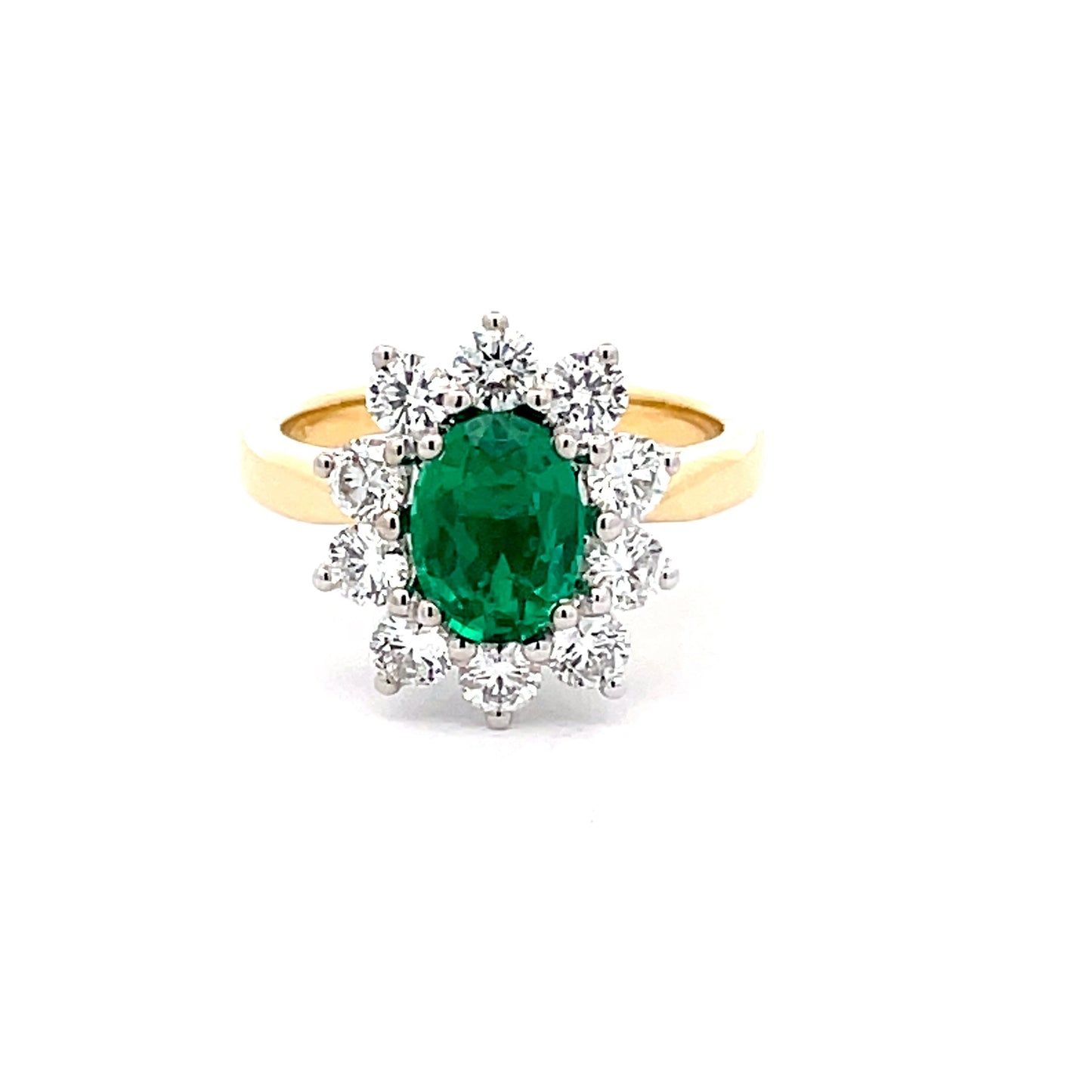 Oval Emerald AND ROUND BRILLIANT CUT DIAMOND CLUSTER STYLE RING Gardiner Brothers