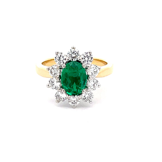 Oval Emerald AND ROUND BRILLIANT CUT DIAMOND CLUSTER STYLE RING  Gardiner Brothers