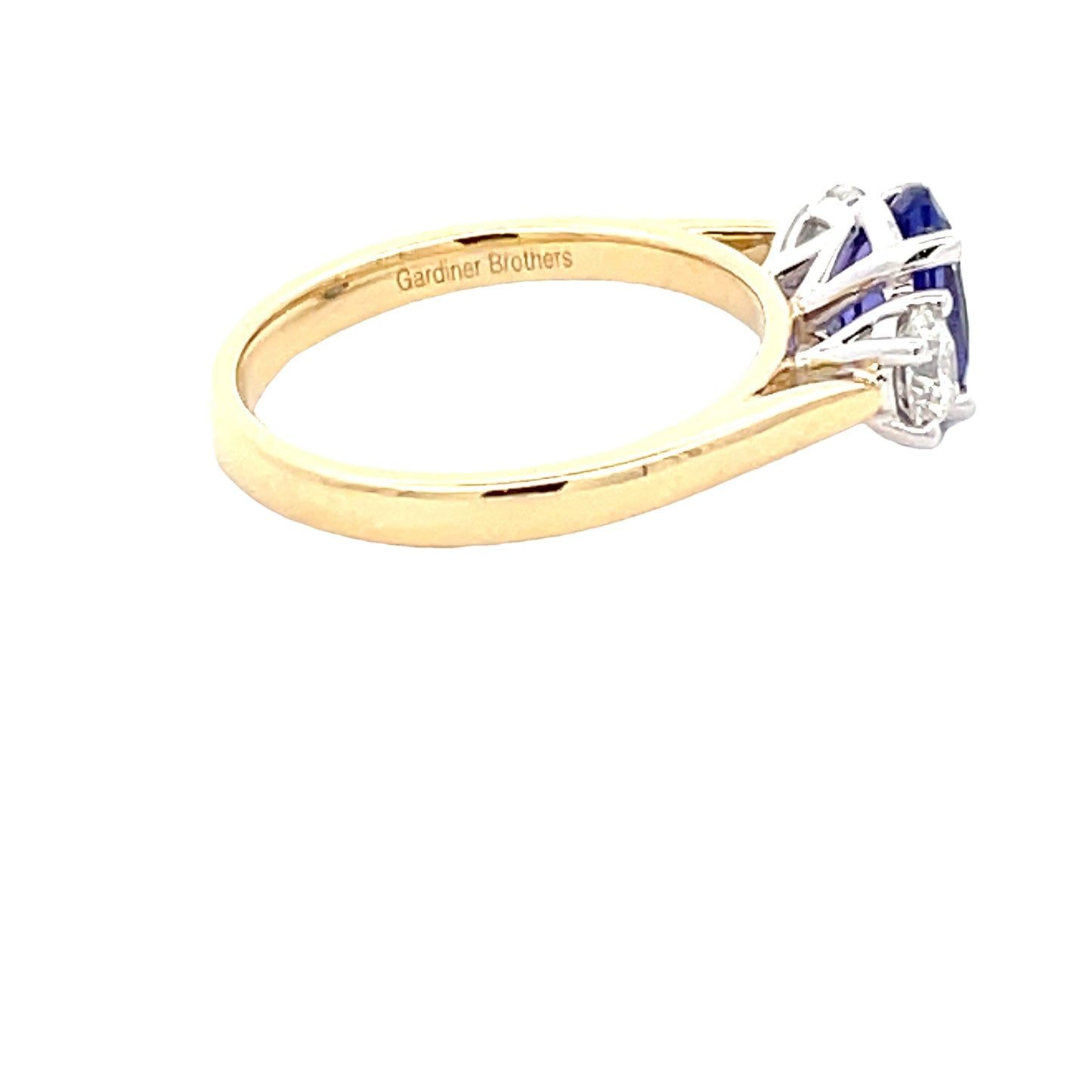 Oval Shaped Tanzanite and Round Brilliant Cut Diamond 3 Stone Ring Gardiner Brothers