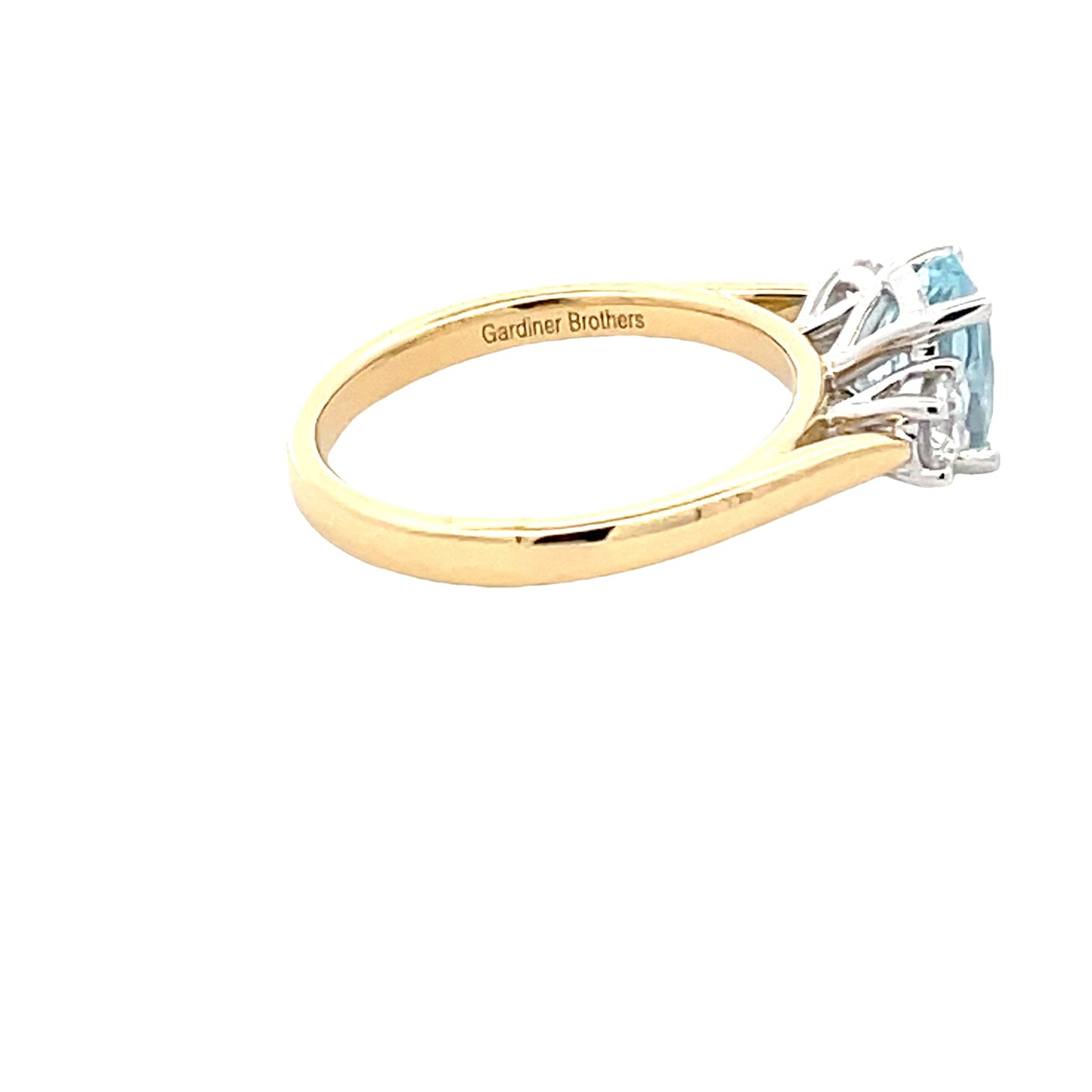 Oval Aquamarine and round brilliant cut diamond 3 stone ring Gardiner Brothers