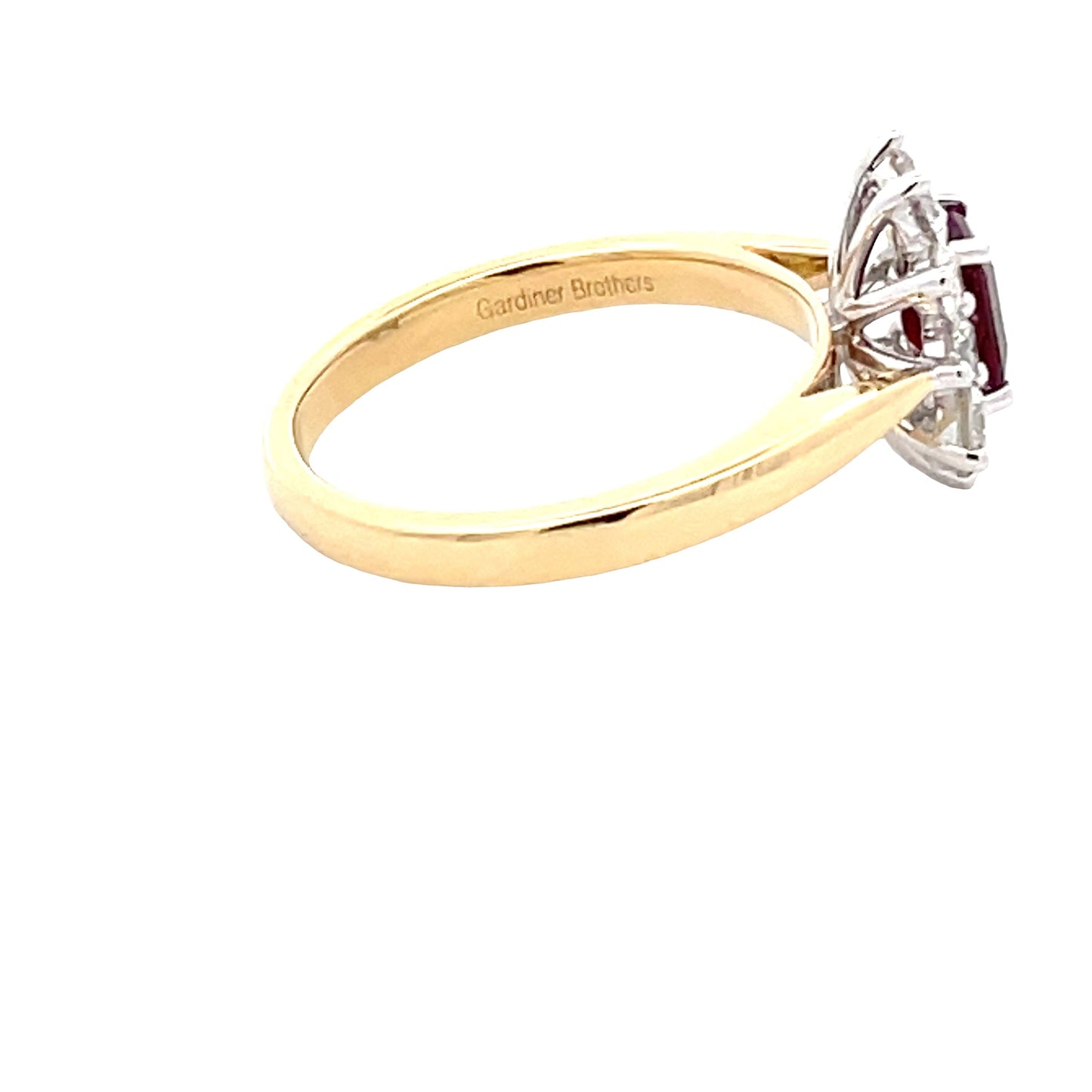Octagonal Shaped Ruby and Round Brilliant Cut Diamond Cluster Ring gardiner-brothers