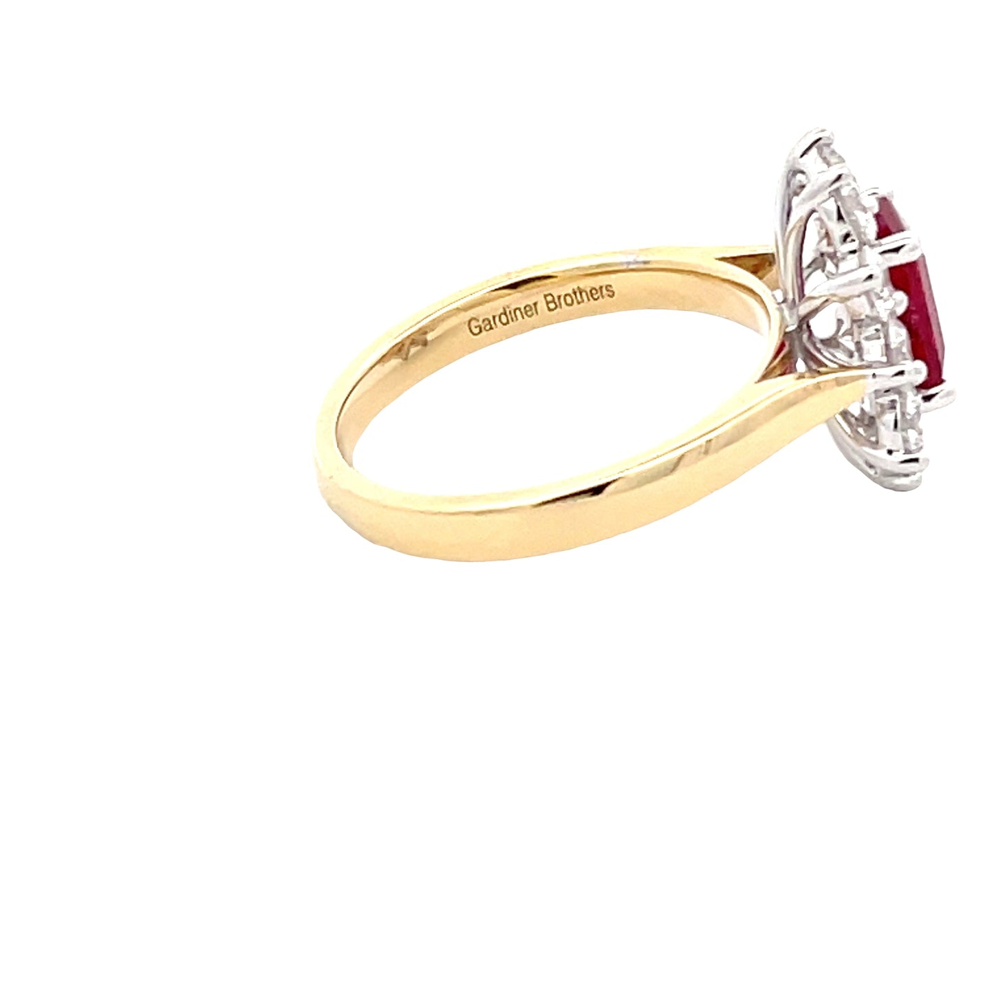 Octagonal shaped ruby and round brilliant cut diamond cluster style ring Gardiner Brothers