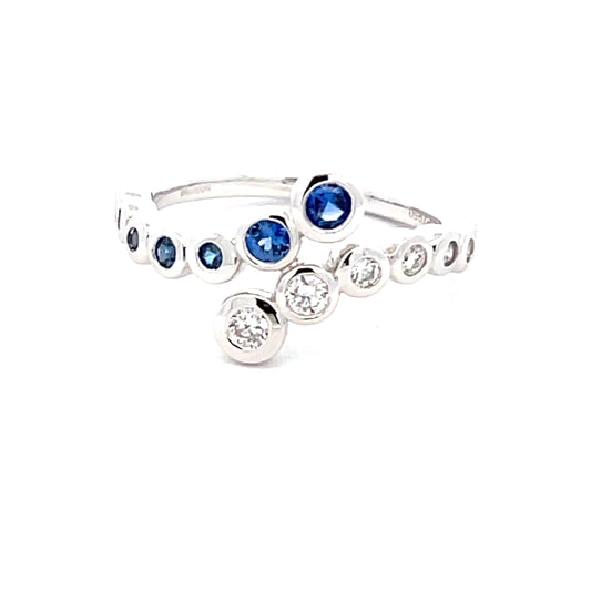 Sapphire and round brilliant cut diamond cross-over ring  Gardiner Brothers