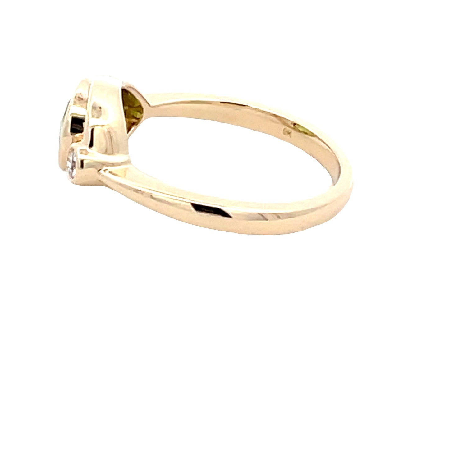 Pear shaped Peridot and round brilliant cut diamond dress ring Gardiner Brothers