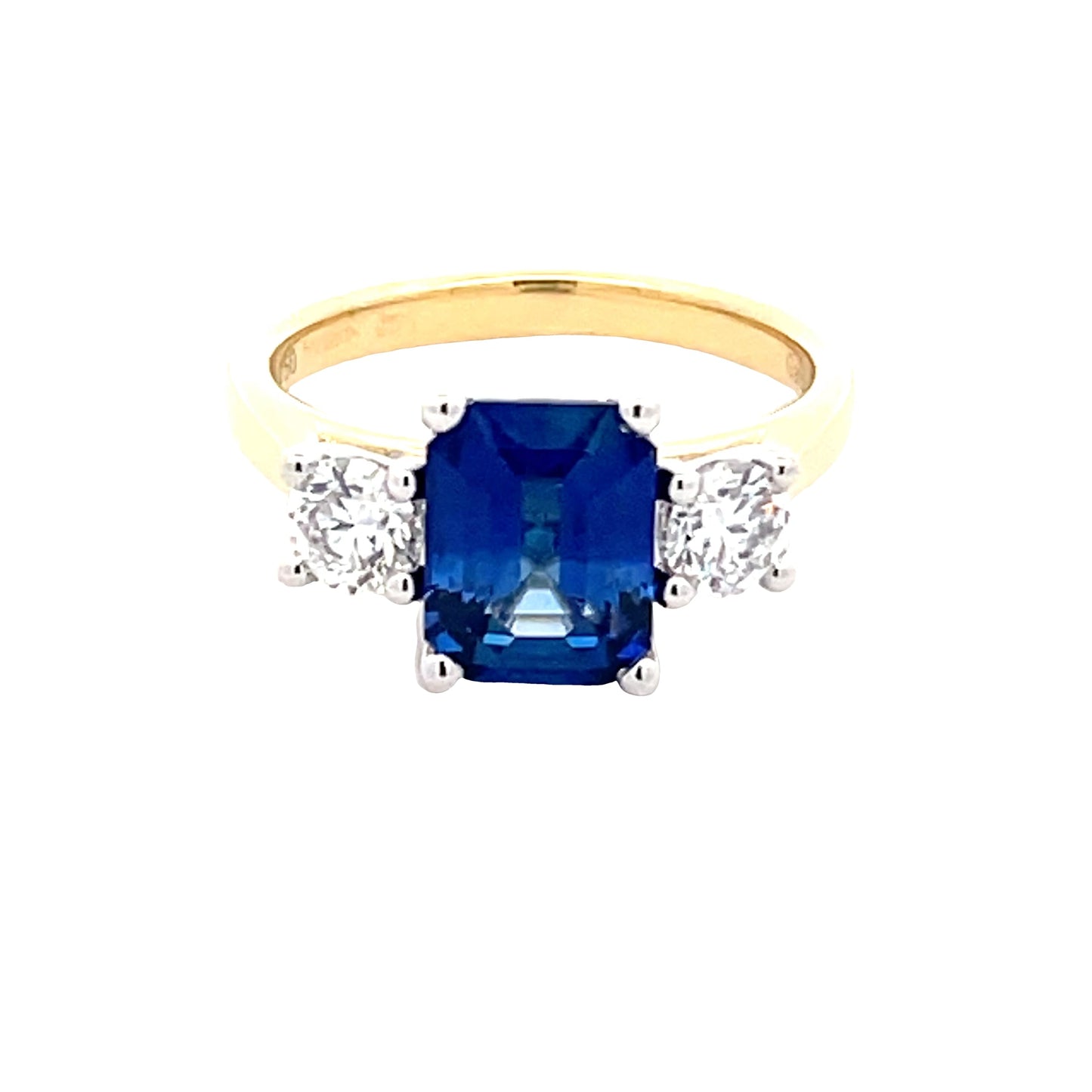 Octagonal Shaped Sapphire and round brilliant cut diamond 3 stone ring Gardiner Brothers