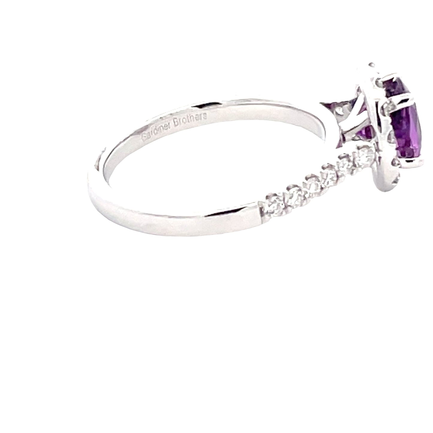 Purple Sapphire and round brilliant cut diamond halo cluster ring Gardiner Brothers
