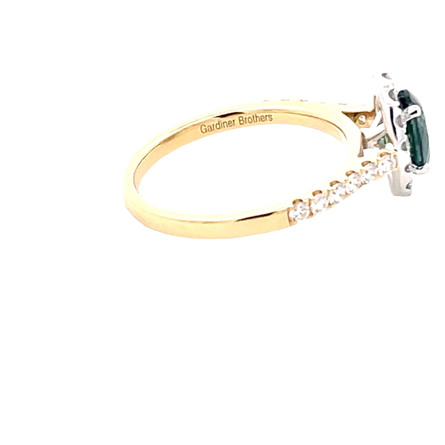 Oval Shaped Teal Sapphire and round brilliant cut diamond halo cluster style ring Gardiner Brothers