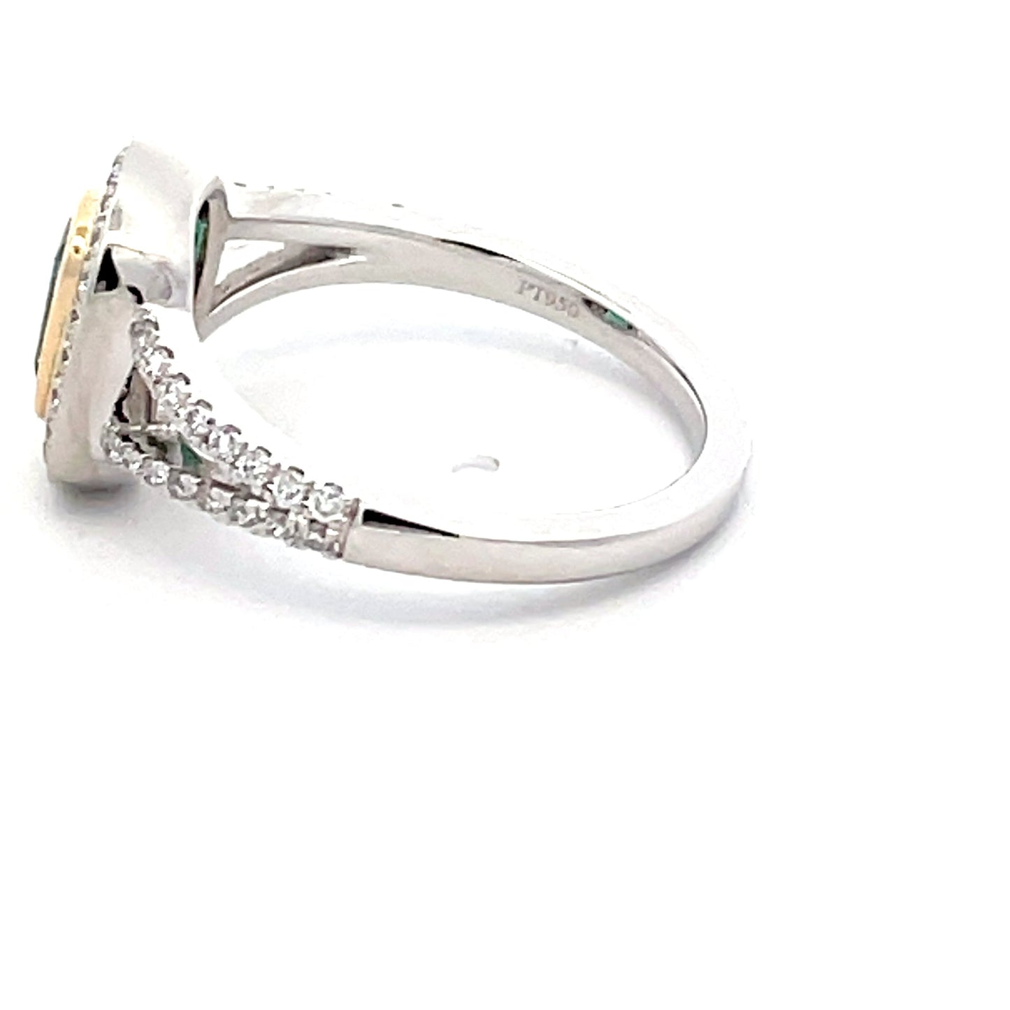 Octagonal emerald with round brilliant cut diamond halo cluster style ring Gardiner Brothers