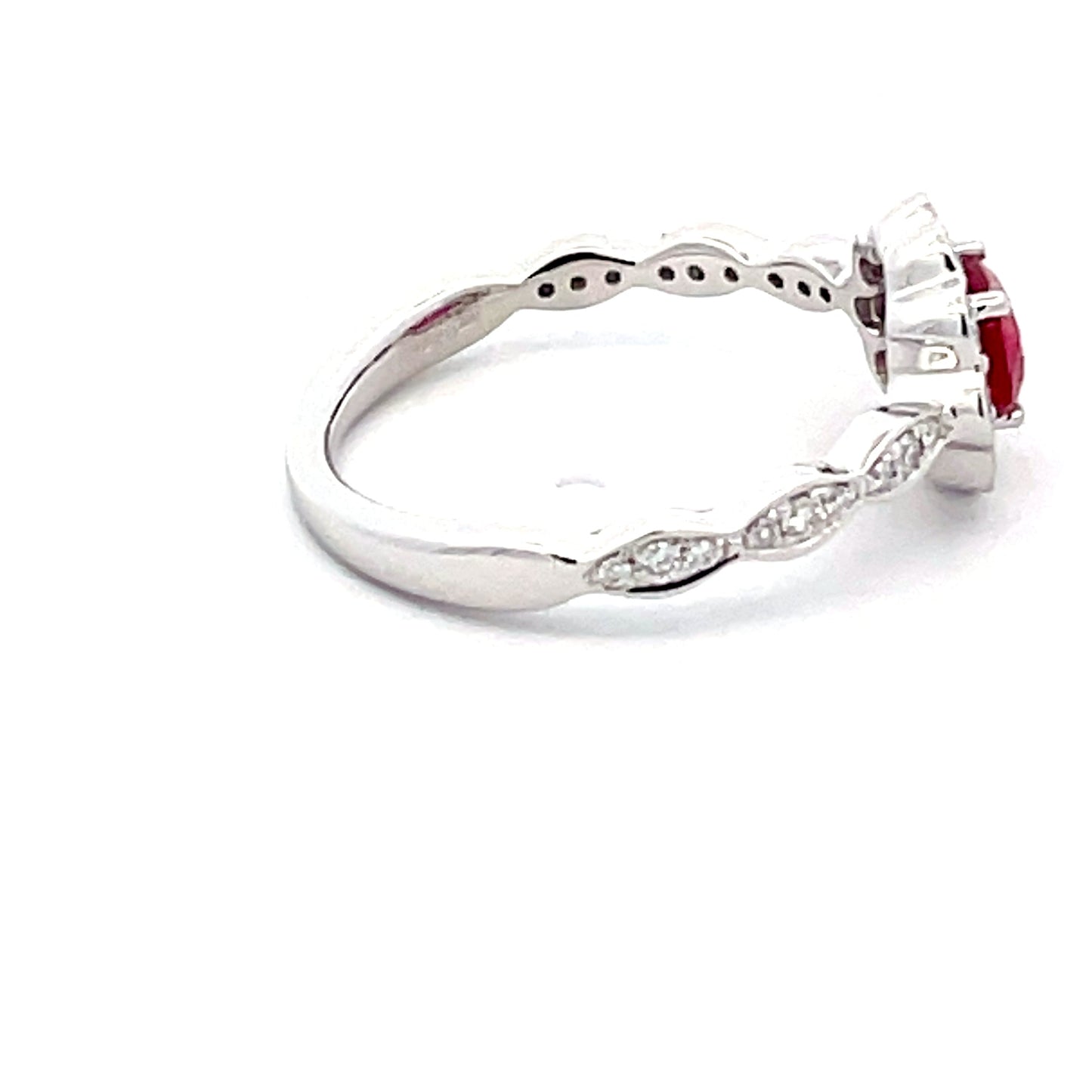 Oval Shaped Ruby and around brilliant cut diamond vintage style cluster Gardiner Brothers