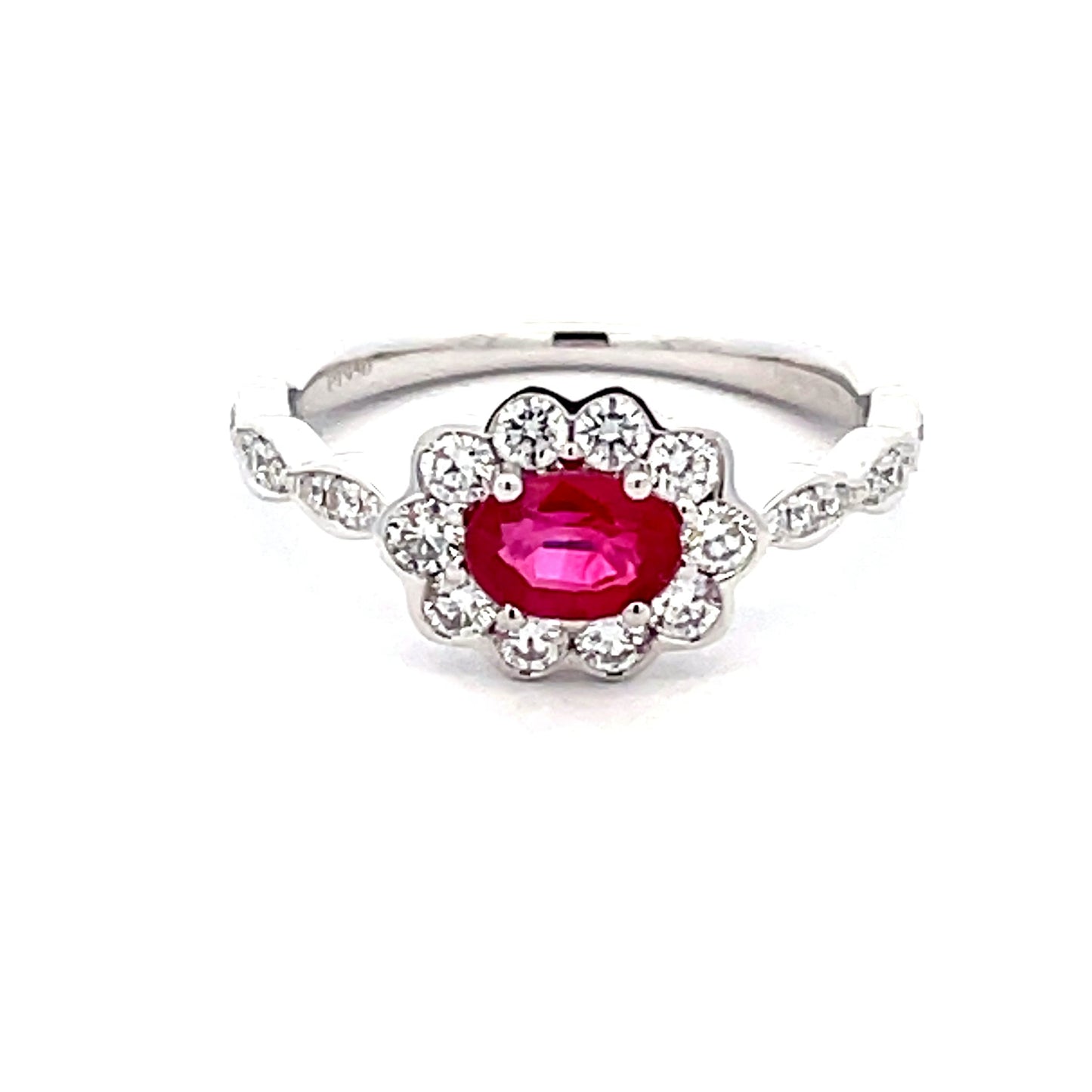 Oval Shaped Ruby and around brilliant cut diamond vintage style cluster Gardiner Brothers