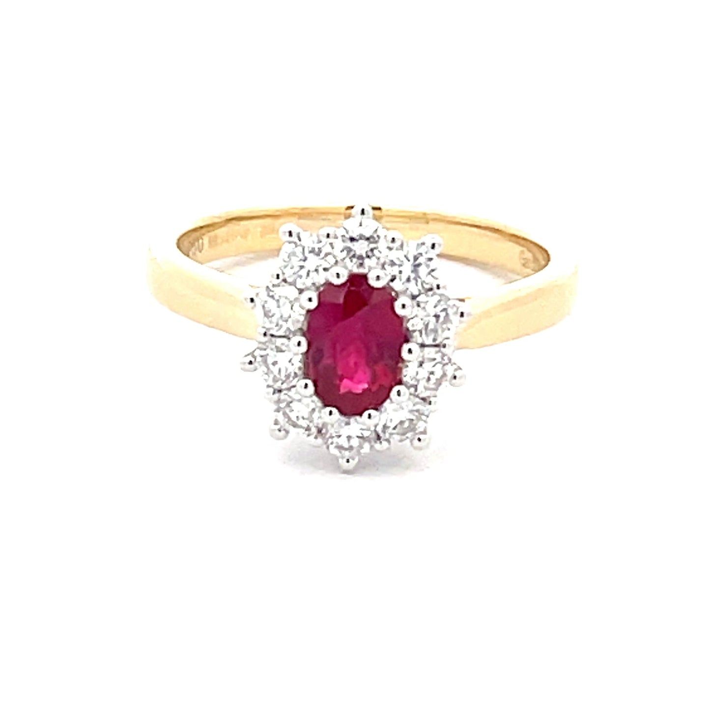 Oval Shaped Ruby and round brilliant cut diamond cluster style ring Gardiner Brothers