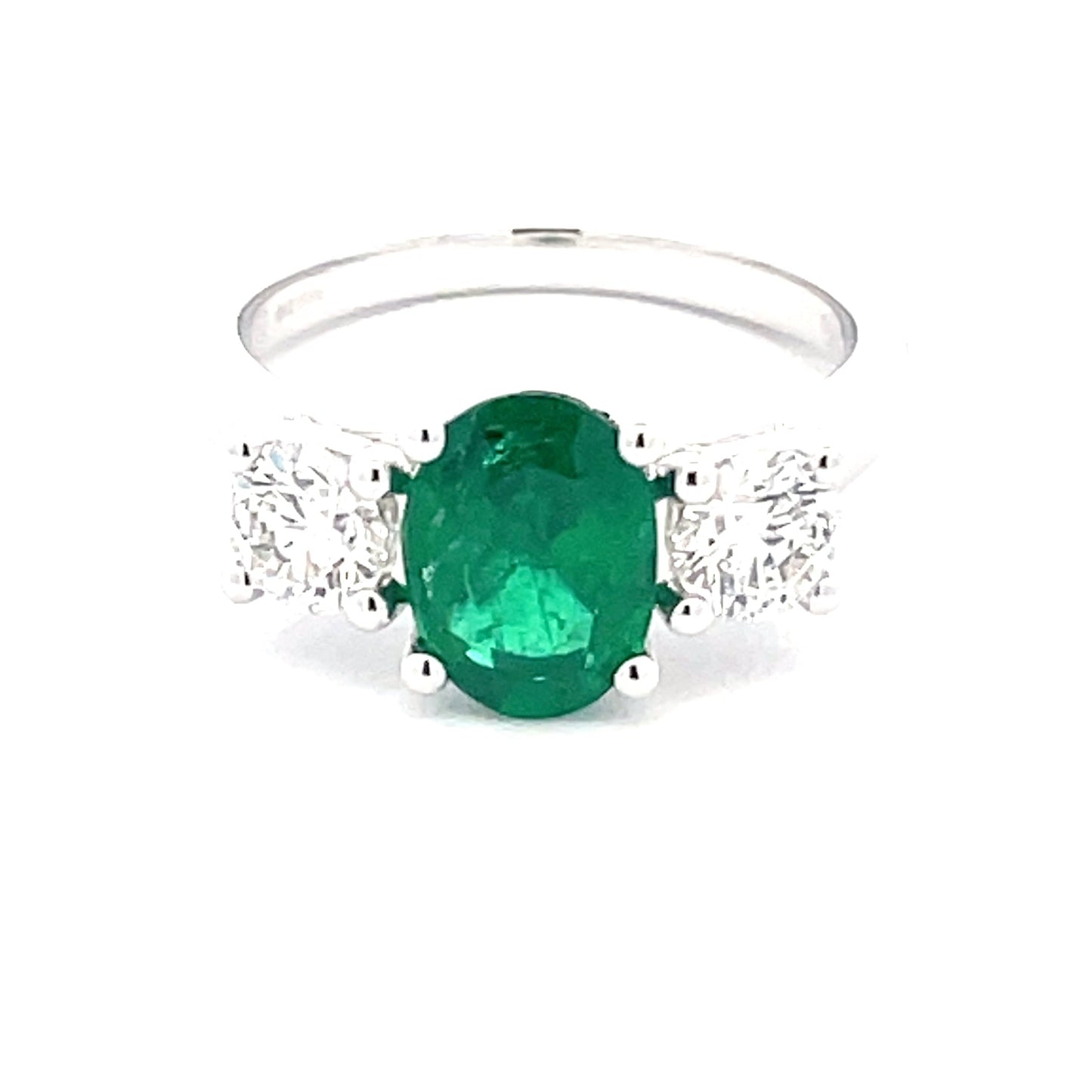 Oval Emerald and round brilliant cut diamond 3 stone ring Gardiner Brothers