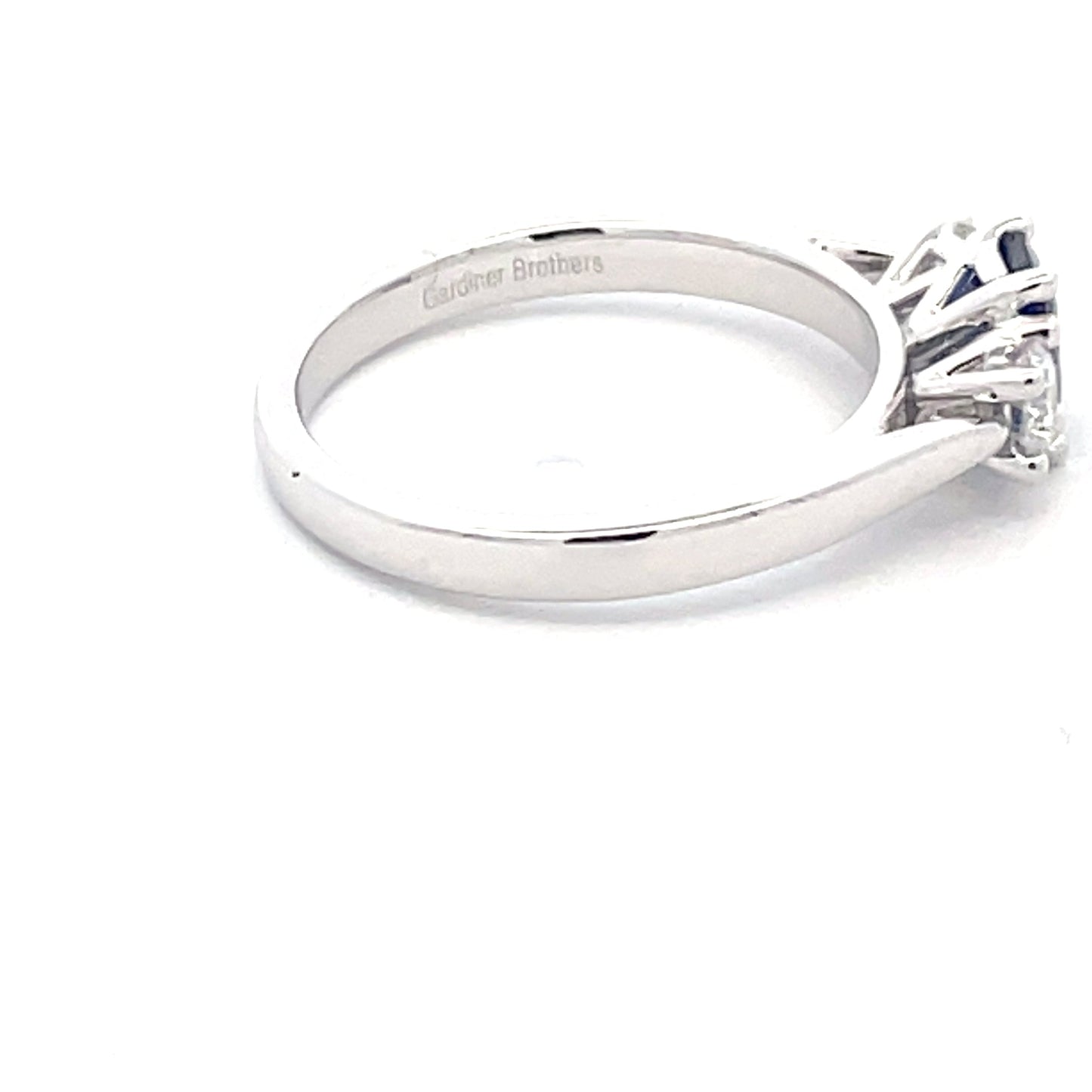 Octagonal Sapphire and round brilliant cut diamond 3 stone ring Gardiner Brothers