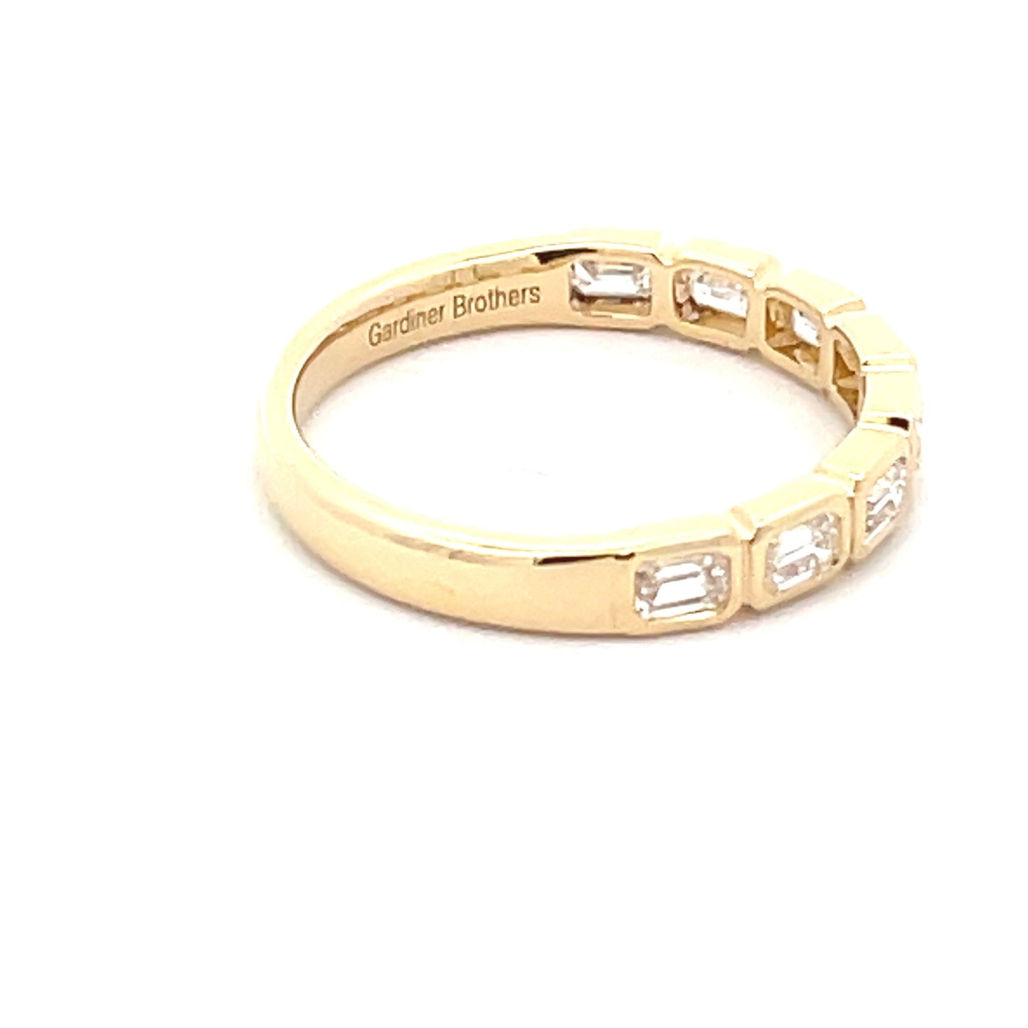 Emerald cut diamond 8 stone eternity style ring Gardiner Brothers