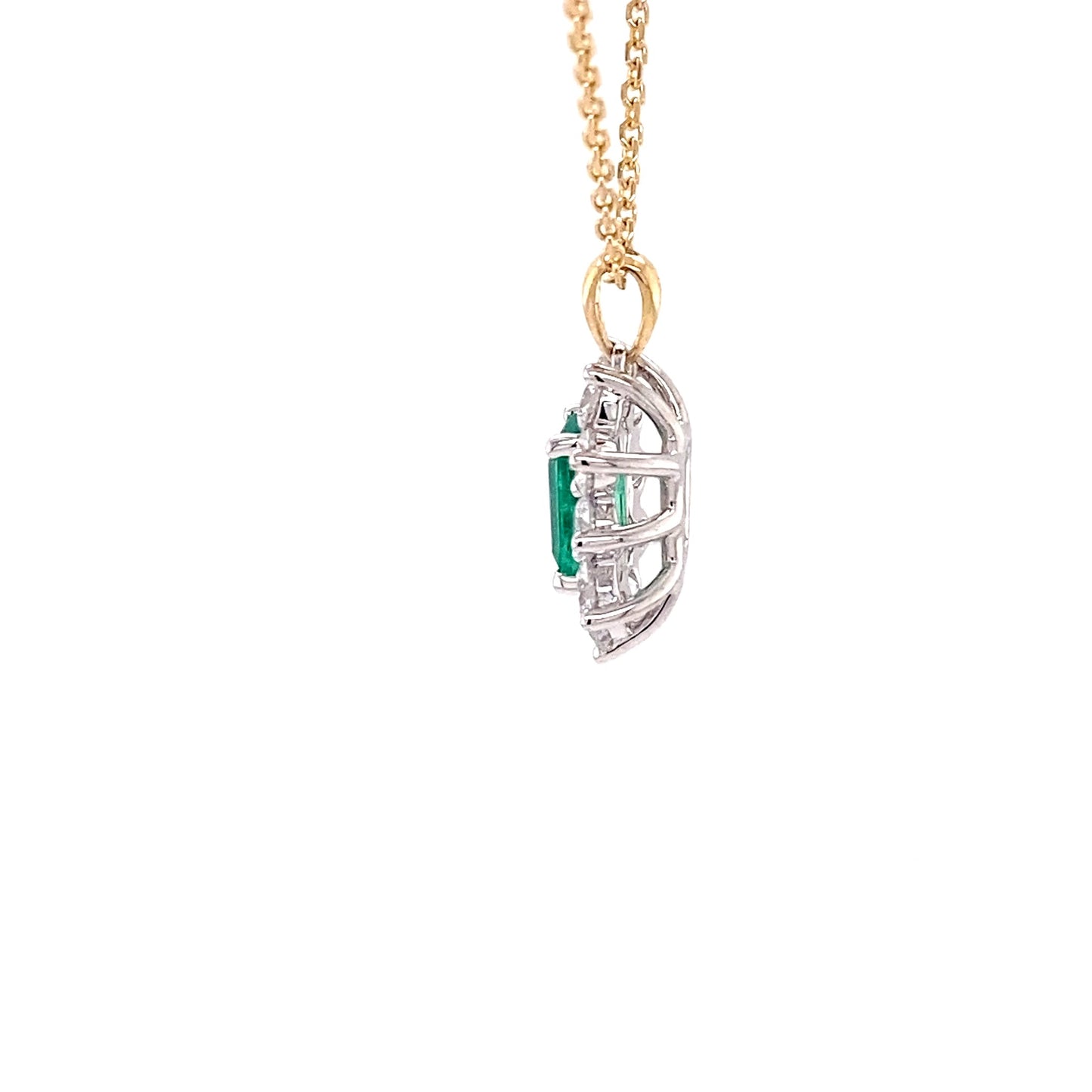 Octagonal emerald and round brilliant cut diamond cluster pendant Gardiner Brothers