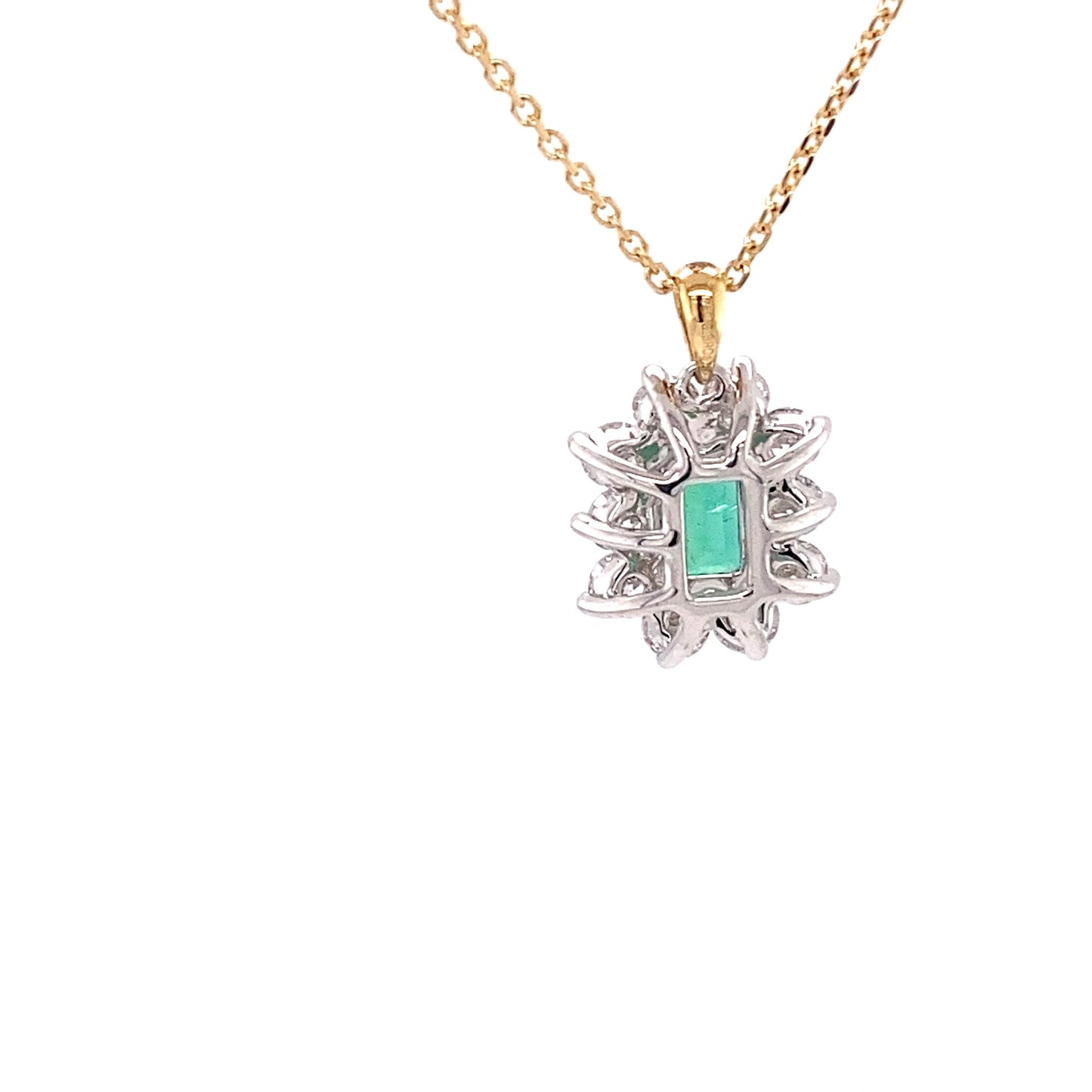 Octagonal emerald and round brilliant cut diamond cluster pendant Gardiner Brothers