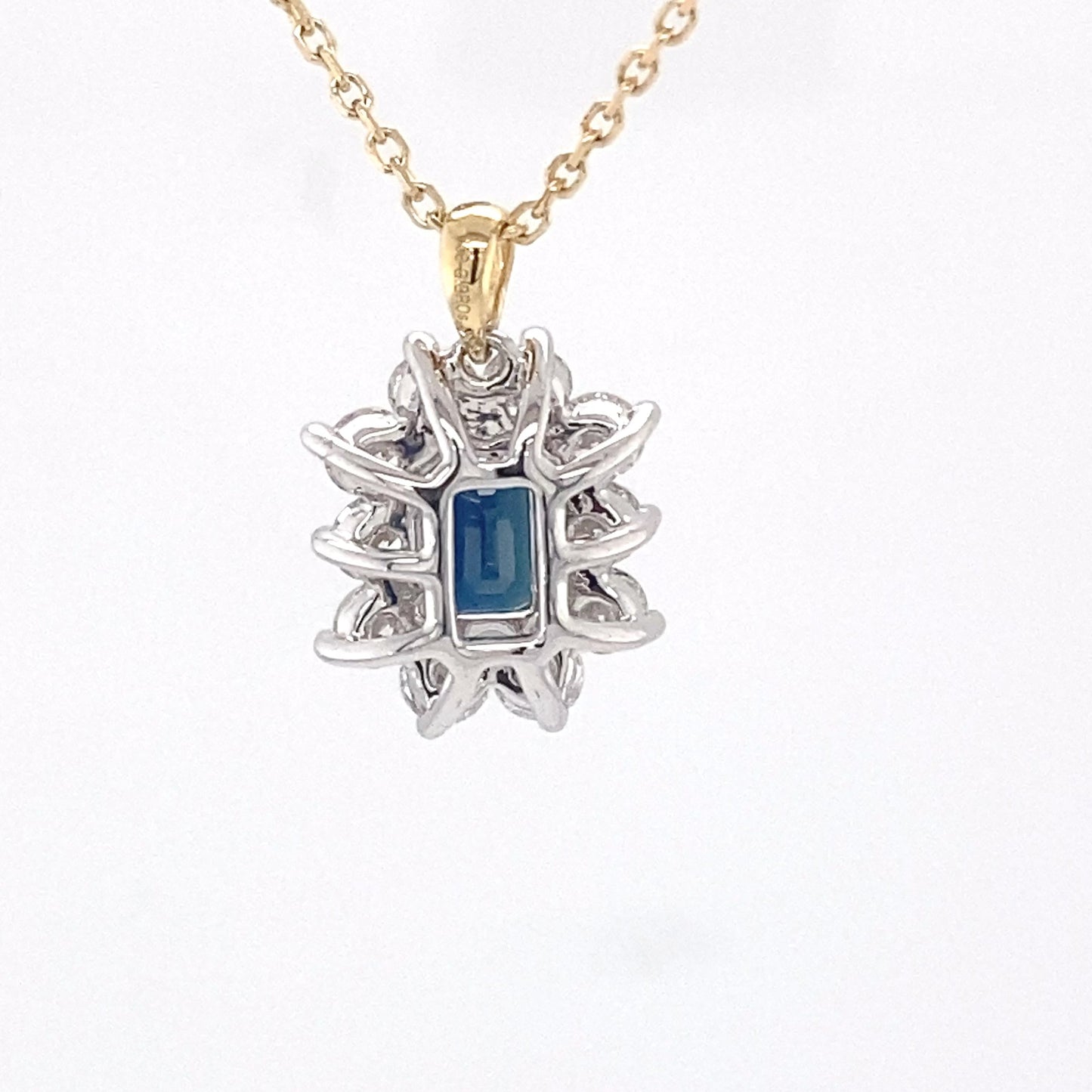 Octagonal sapphire and round brilliant cut diamond cluster pendant Gardiner Brothers