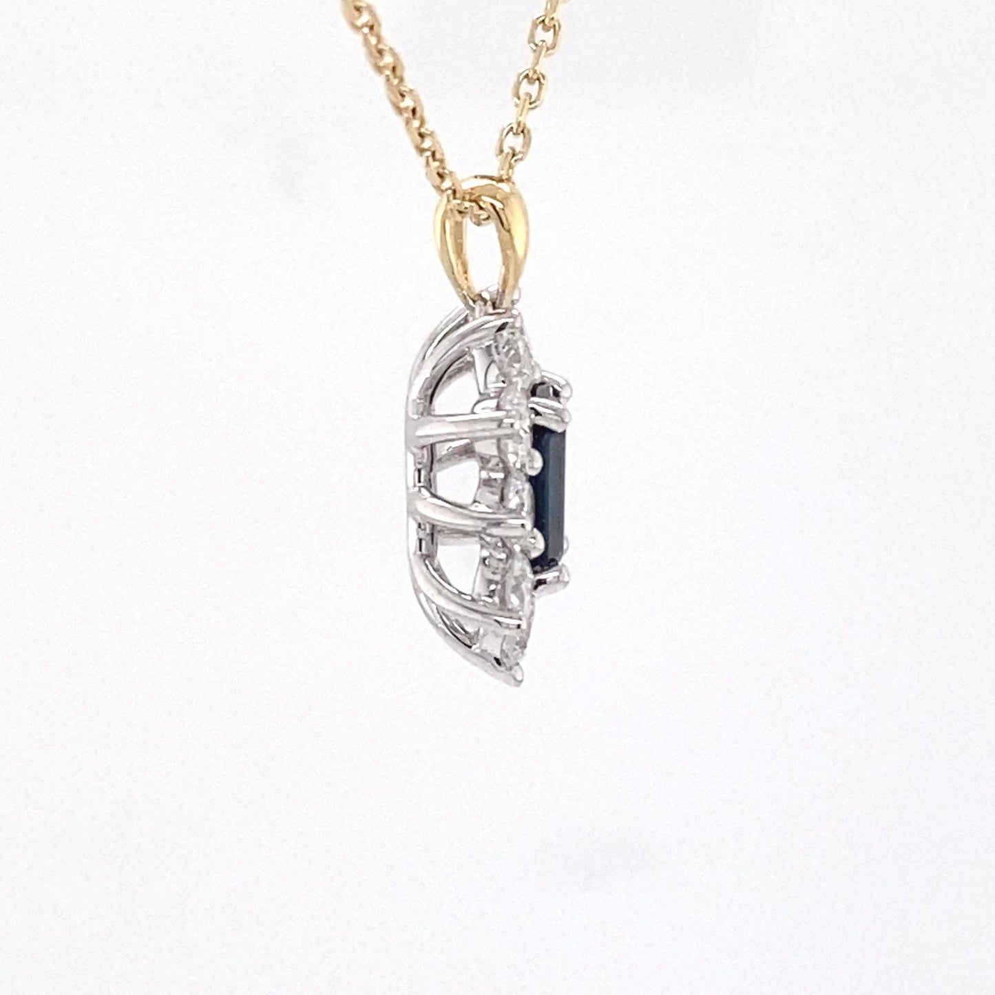 Octagonal sapphire and round brilliant cut diamond cluster pendant Gardiner Brothers