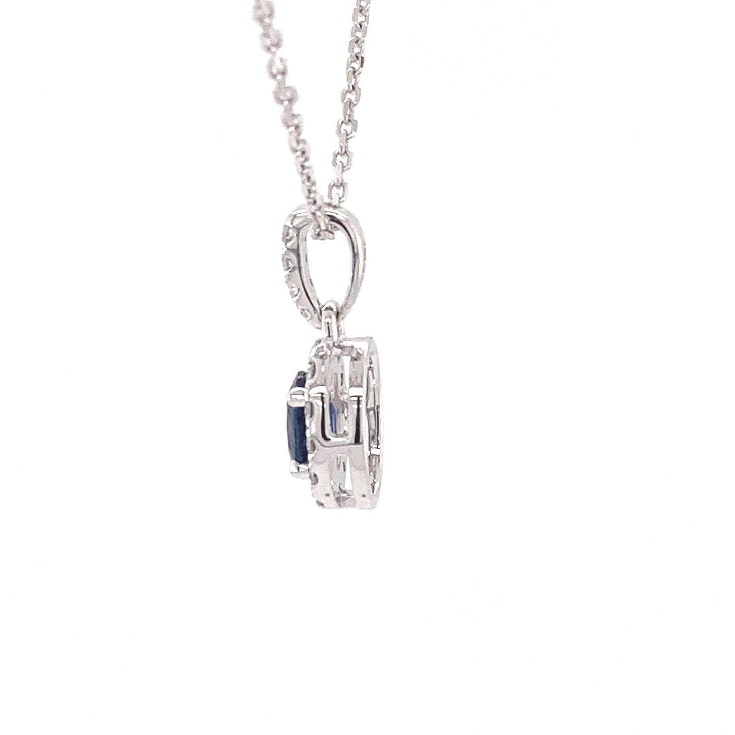 Oval sapphire and round brilliant cut diamond halo style pendant Gardiner Brothers
