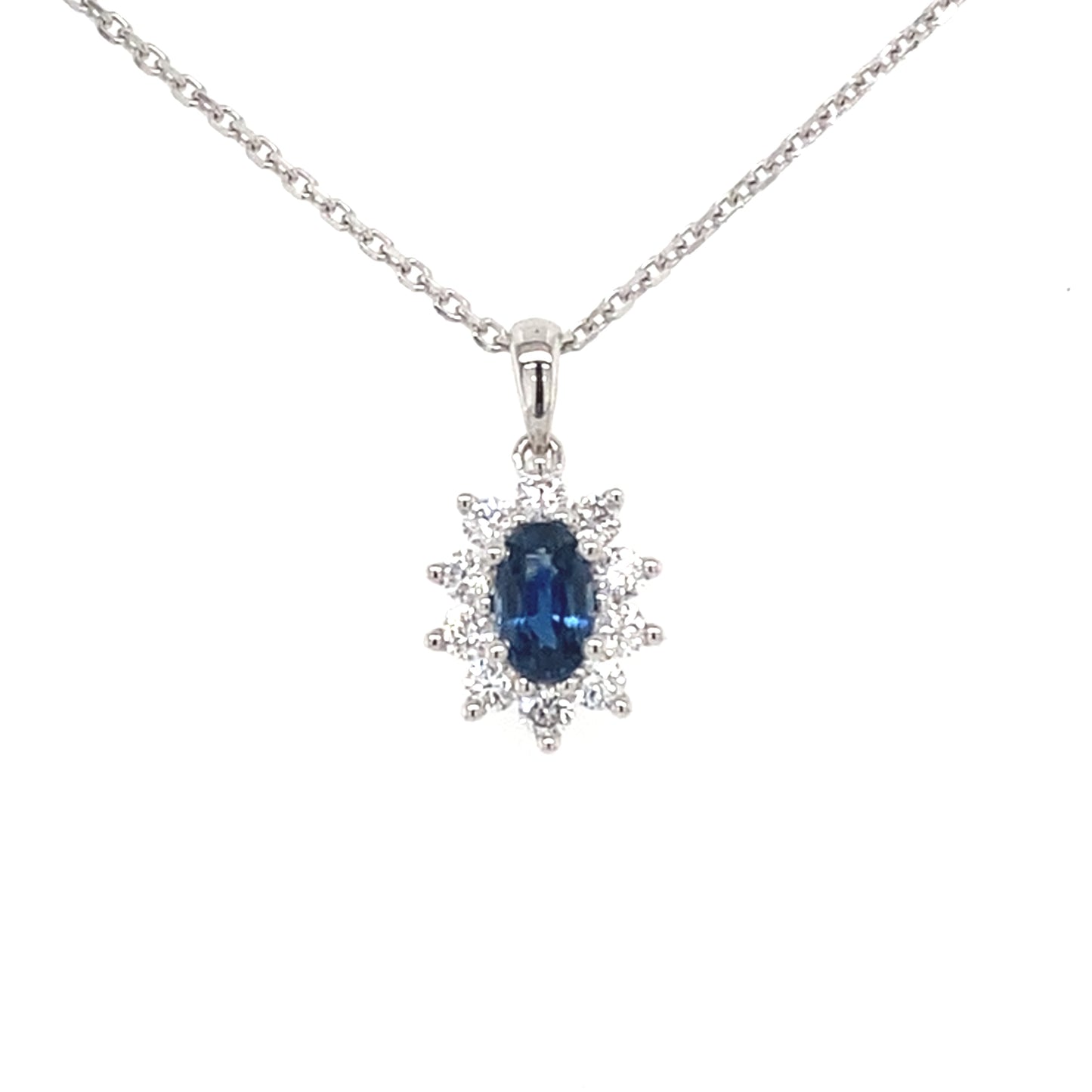 Sapphire and round brilliant cut diamond cluster style pendant Gardiner Brothers