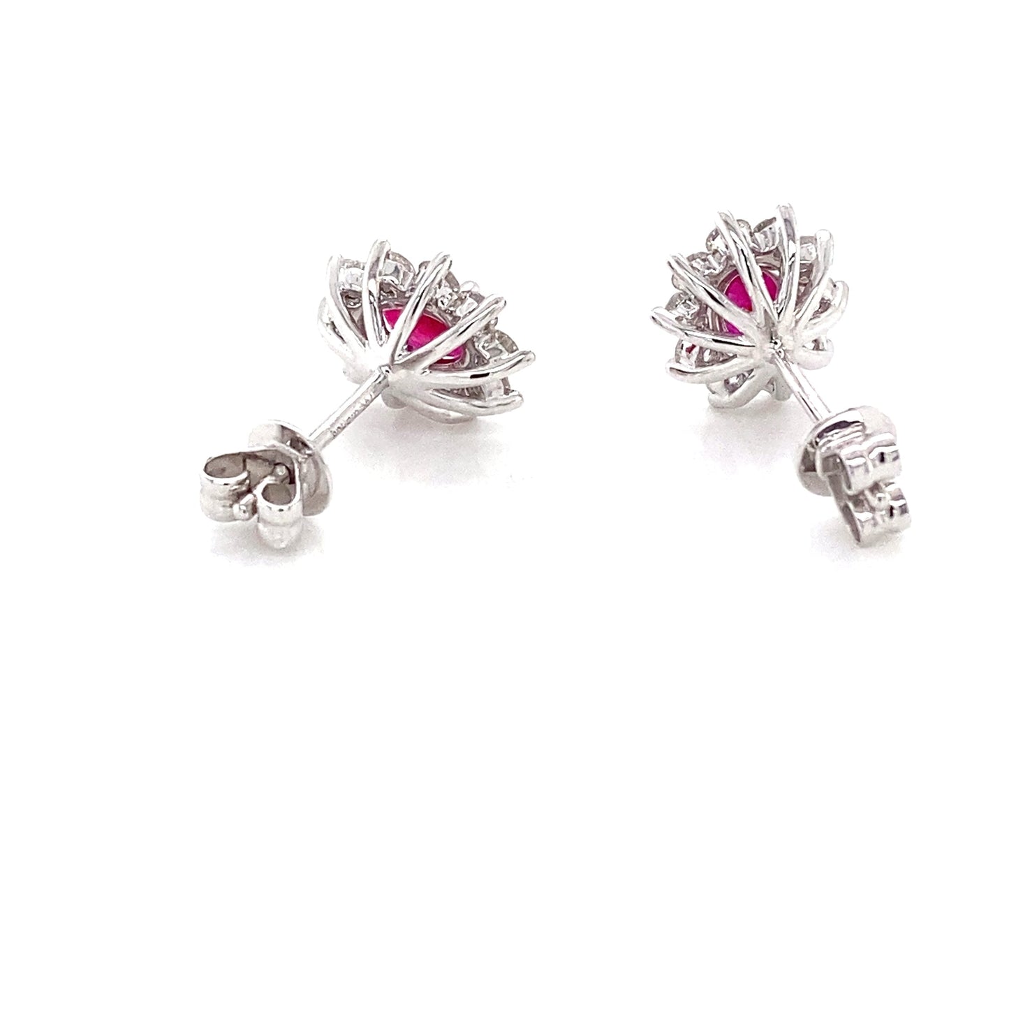 Oval Ruby and round brilliant cut diamond cluster style earrings Gardiner Brothers