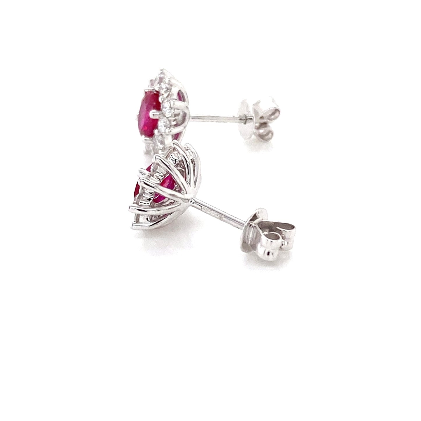 Oval Ruby and round brilliant cut diamond cluster style earrings Gardiner Brothers