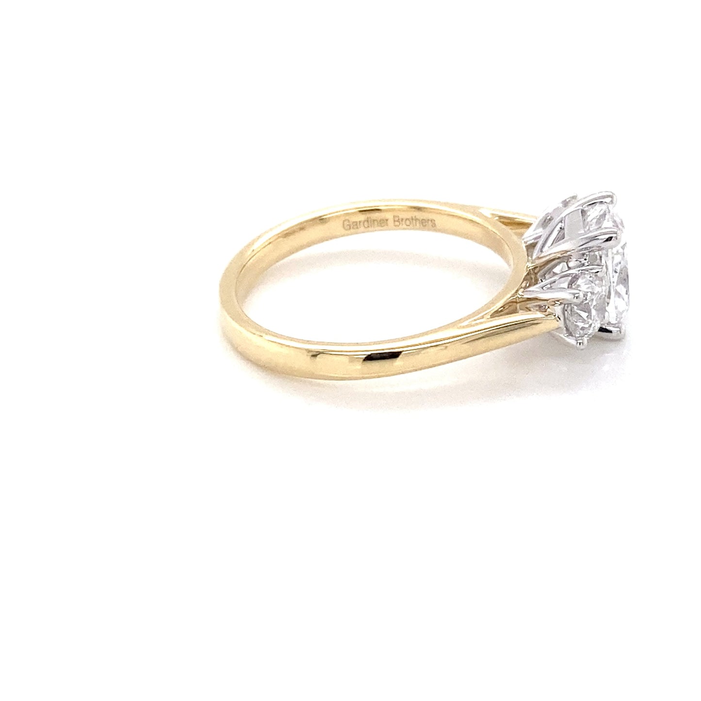 Yellow Gold Cushion and round brilliant cut diamond 3 stone ring - 2.10cts Gardiner Brothers