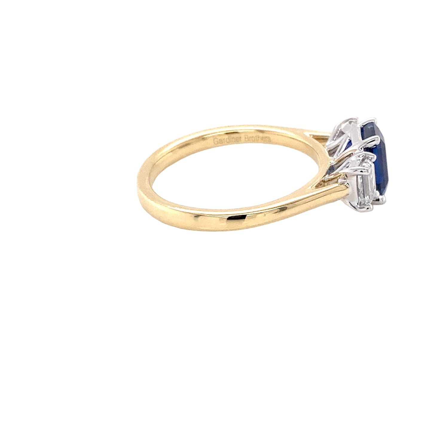 Octagonal shaped sapphire and emerald cut diamond 3 stone ring Gardiner Brothers