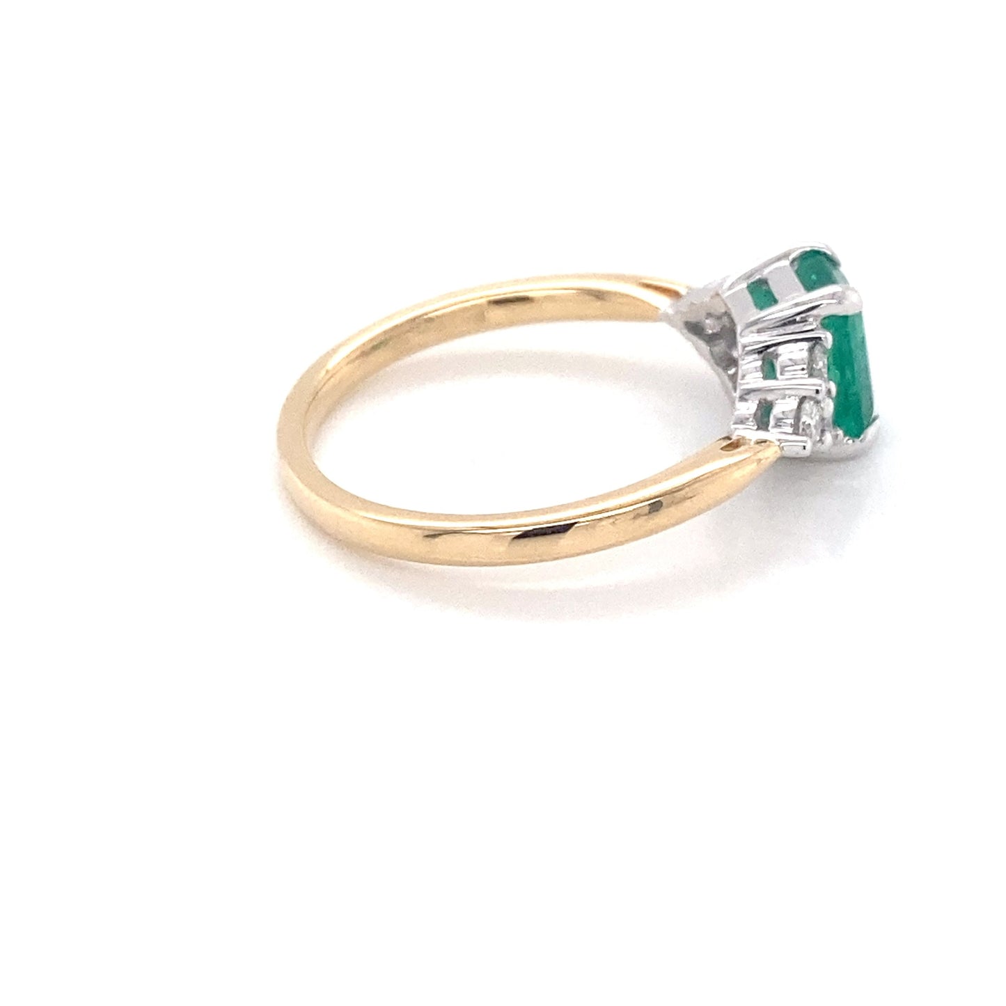 Octagonal shaped emerald and round brilliant cut diamond ring Gardiner Brothers