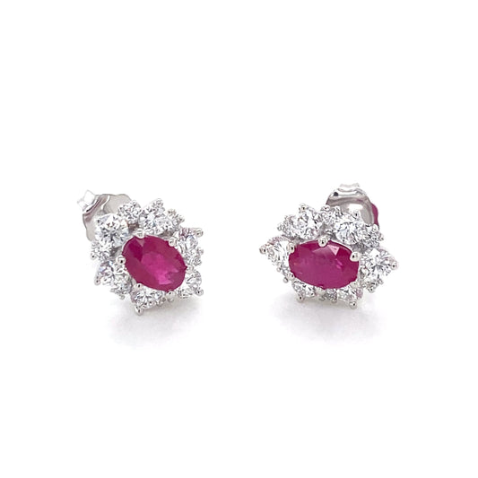 Oval Shaped Ruby and round brilliant cut diamond cluster style earrings Gardiner Brothers