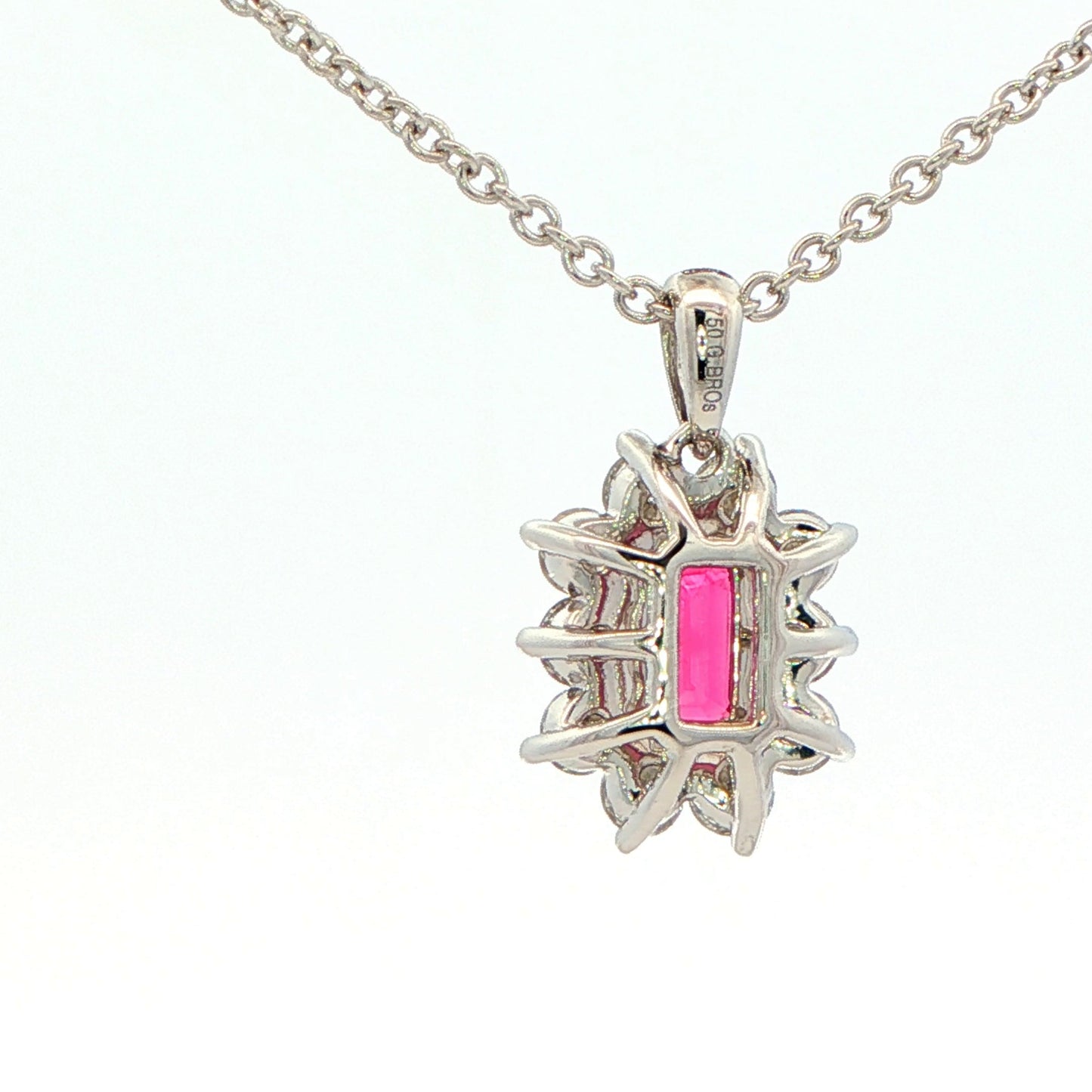 Octagonal shaped Ruby and round brilliant cut diamond cluster style pendant