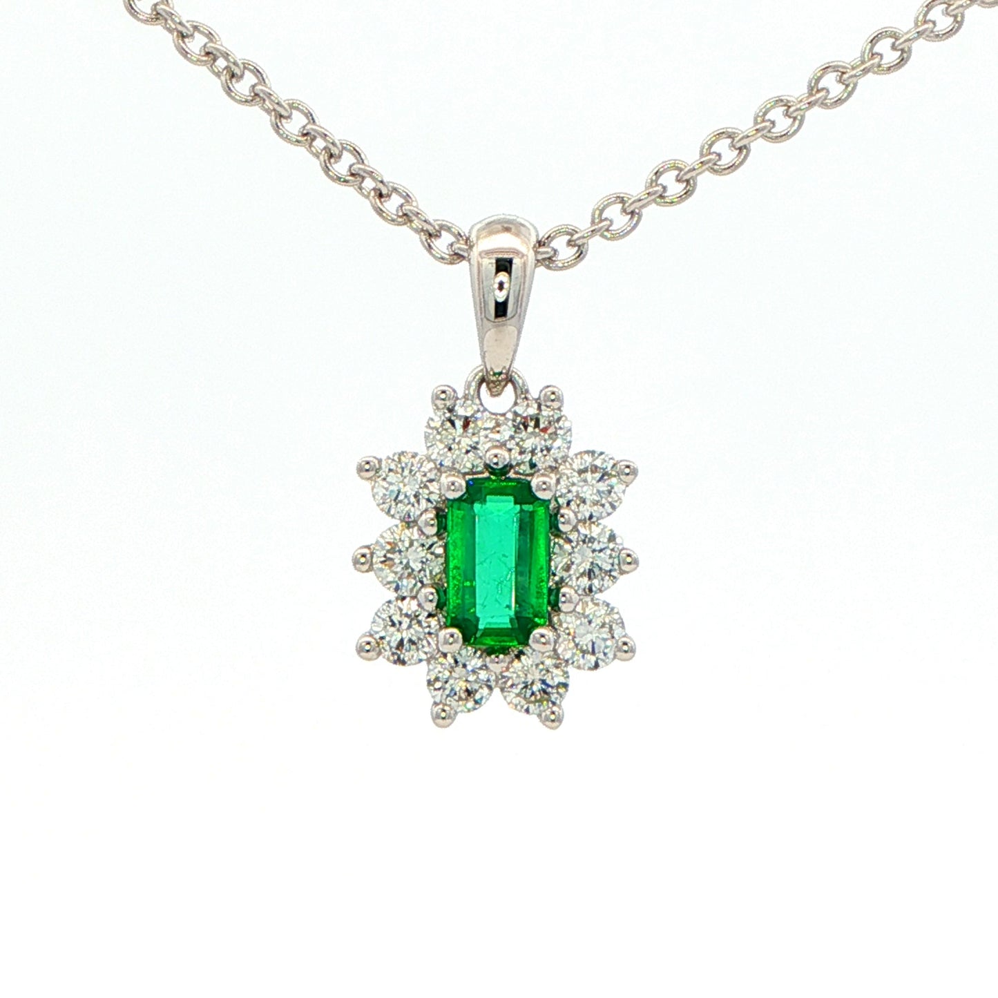 Octagonal shaped emerald and round brilliant cut diamond cluster pendant