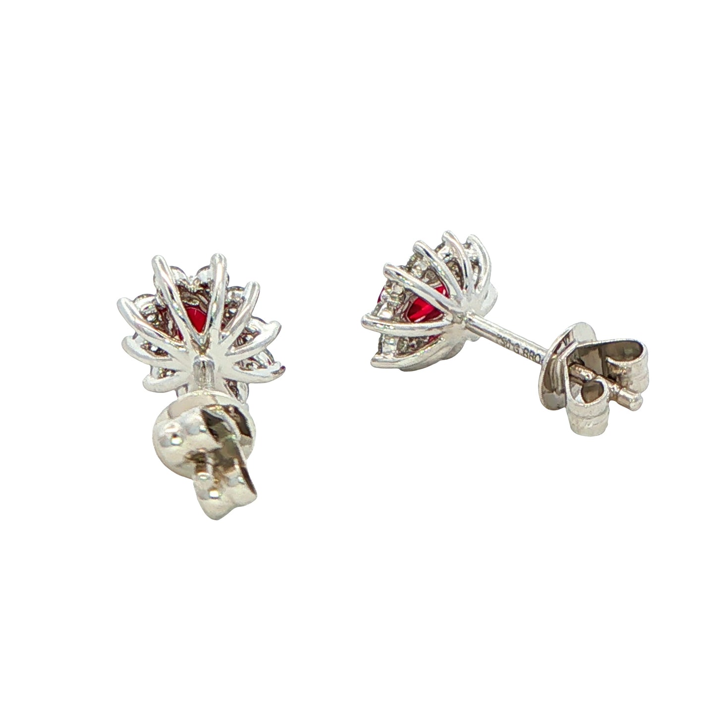 Oval shaped ruby and round brilliant cut diamond cluster style earrings
