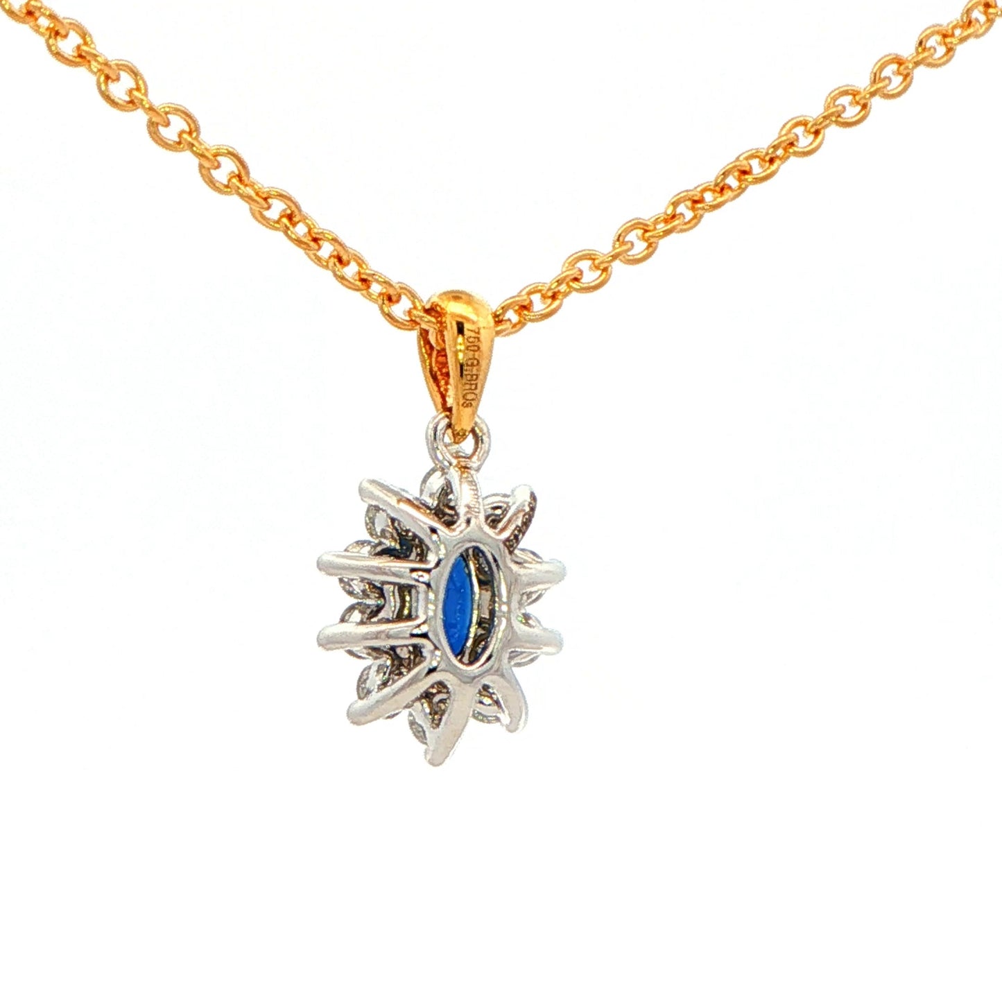Oval shaped sapphire and round brilliant cut diamond cluster style pendant