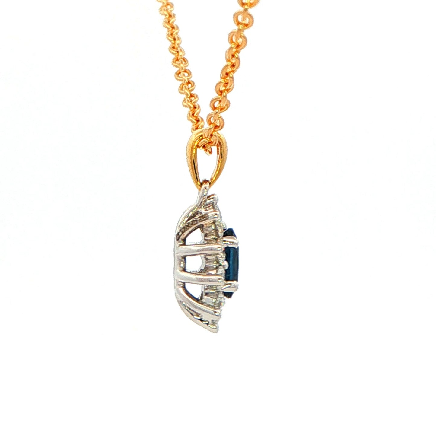Oval shaped sapphire and round brilliant cut diamond cluster style pendant