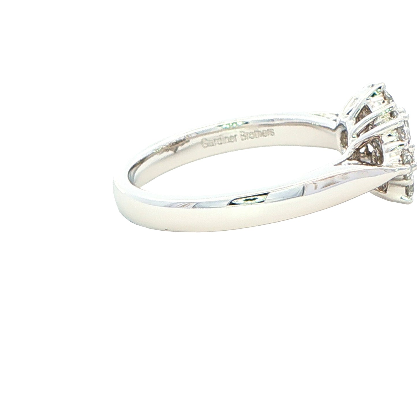 Platinum Emerald and round brilliant cut diamond Boat style cluster ring - 1.00cts Gardiner Brothers