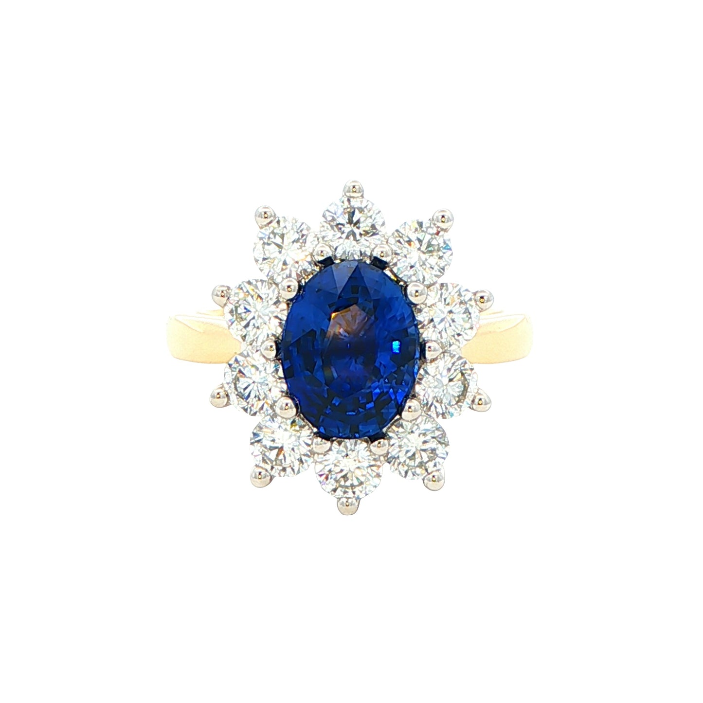 Oval Sapphire and round brilliant cut diamond cluster ring