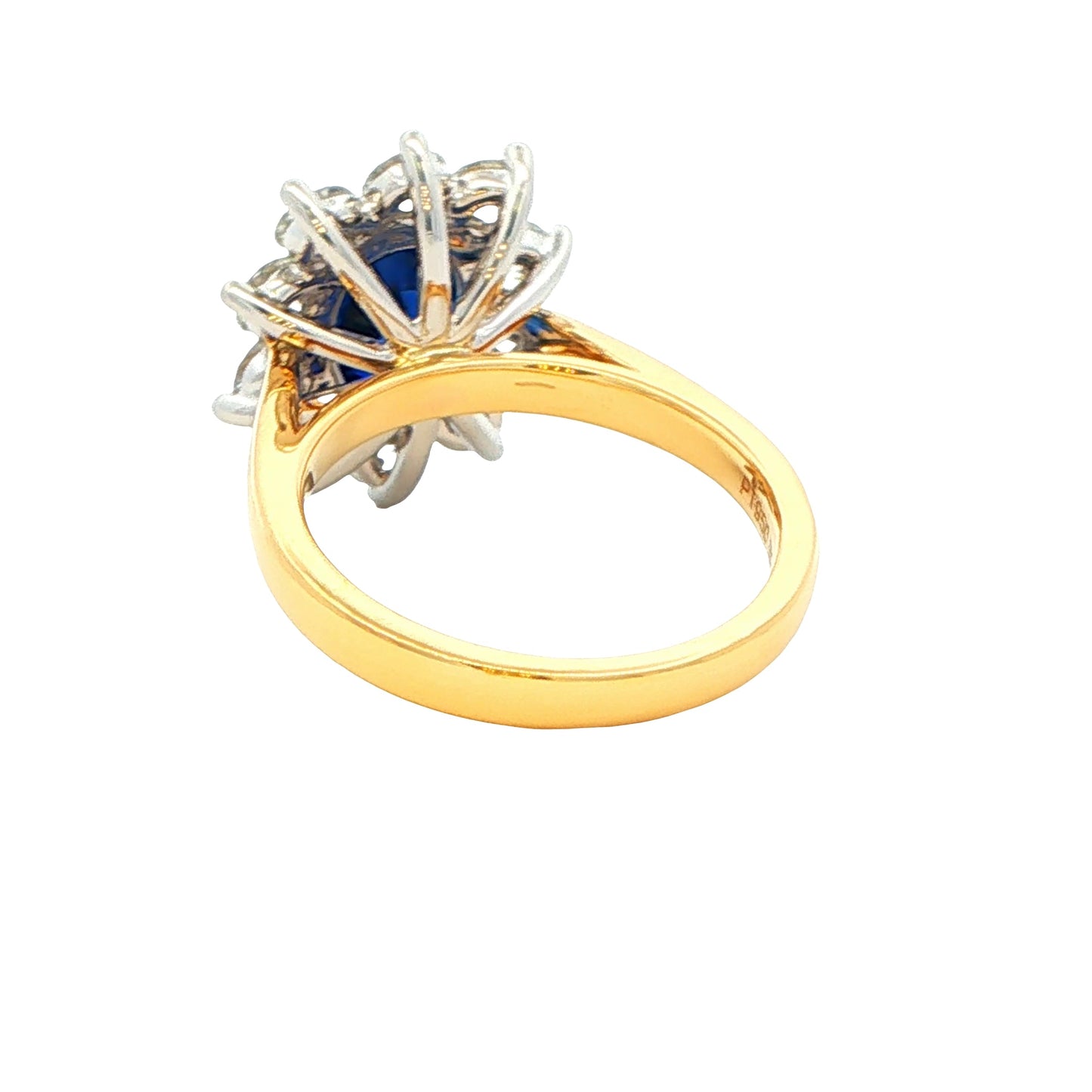 Oval Sapphire and round brilliant cut diamond cluster ring