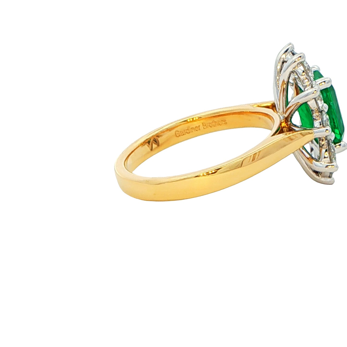 Octagonal shaped Emerald and round brilliant cut diamond cluster style ring Gardiner Brothers