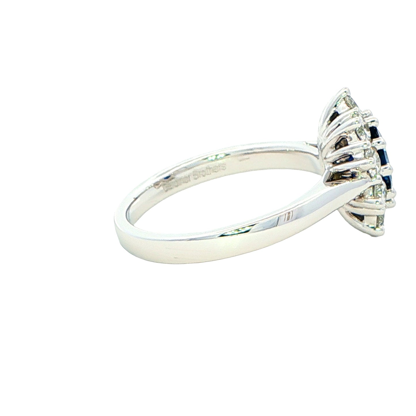 Oval shaped sapphire and round brilliant cut diamond cluster ring Gardiner Brothers