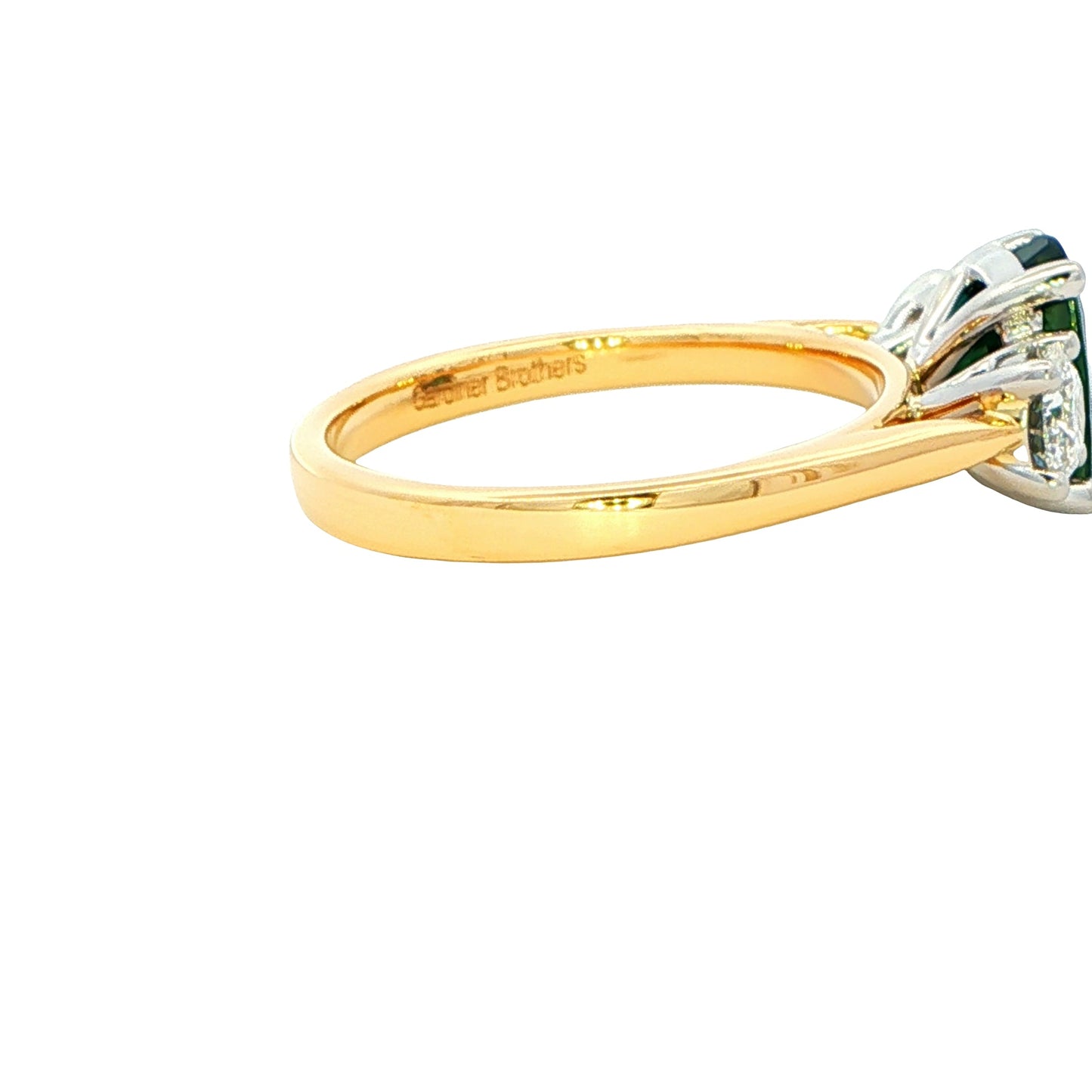 Cushion Shaped Teal Sapphire and round brilliant cut diamond 3 stone ring Gardiner Brothers