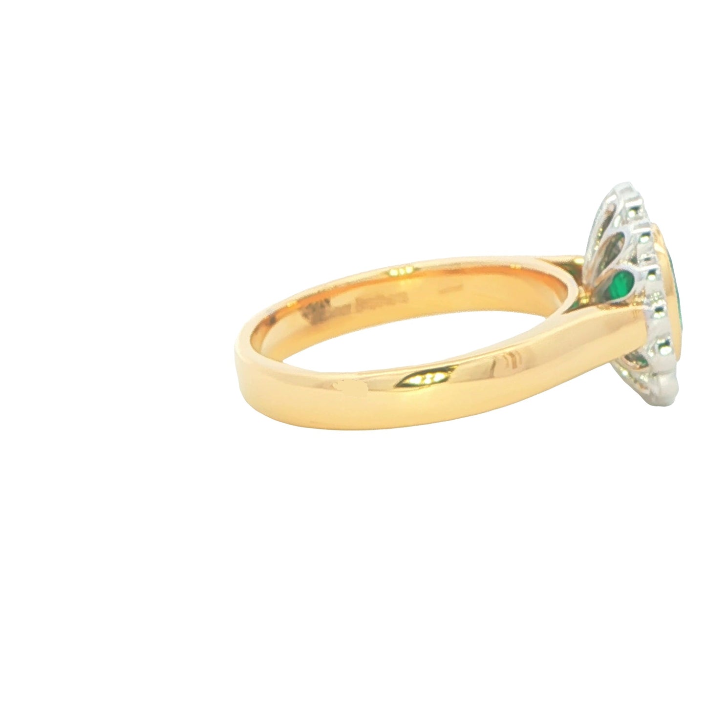 Oval emerald and round brilliant cut diamond vintage style cluster ring