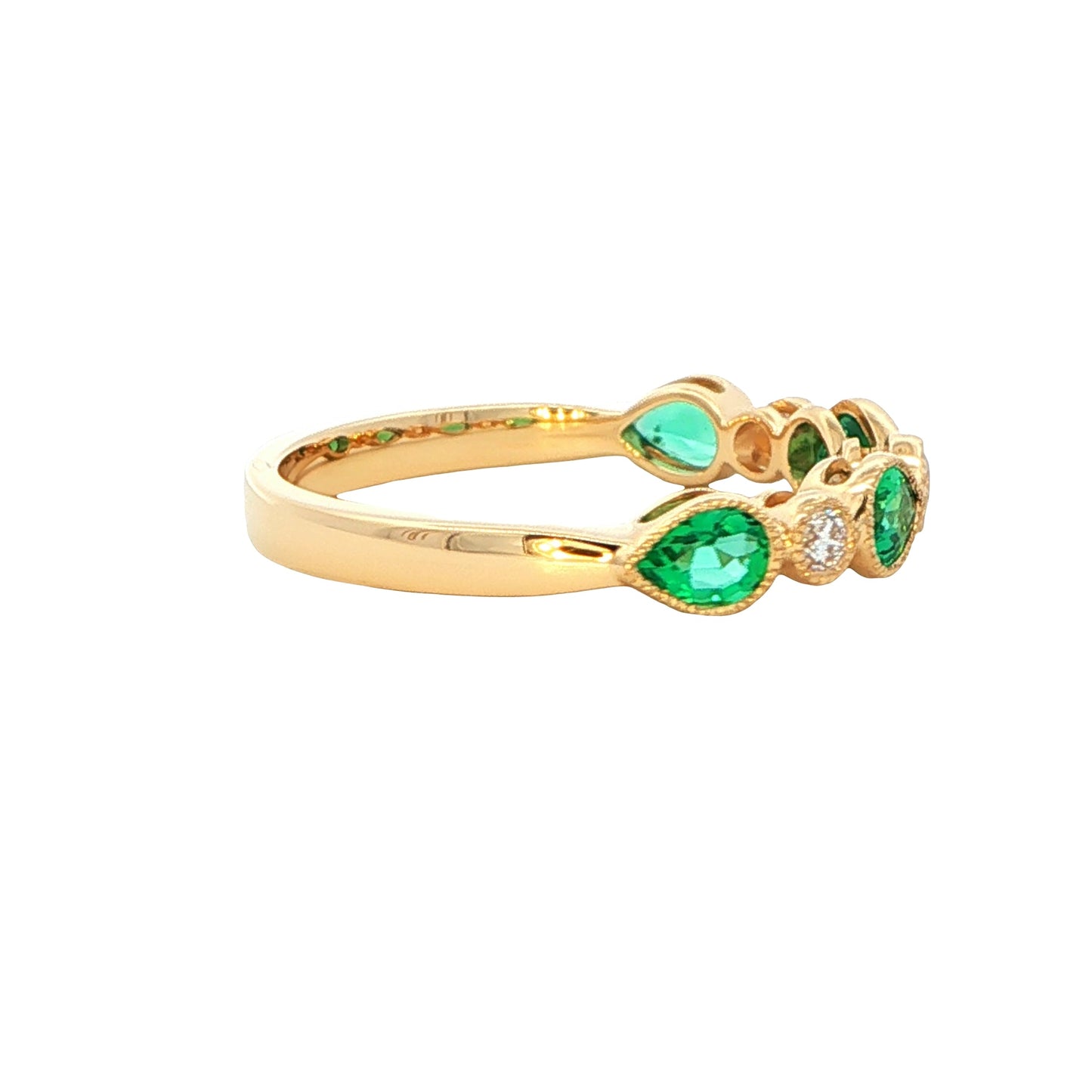 Pear shaped emerald and round brilliant cut diamond dress ring