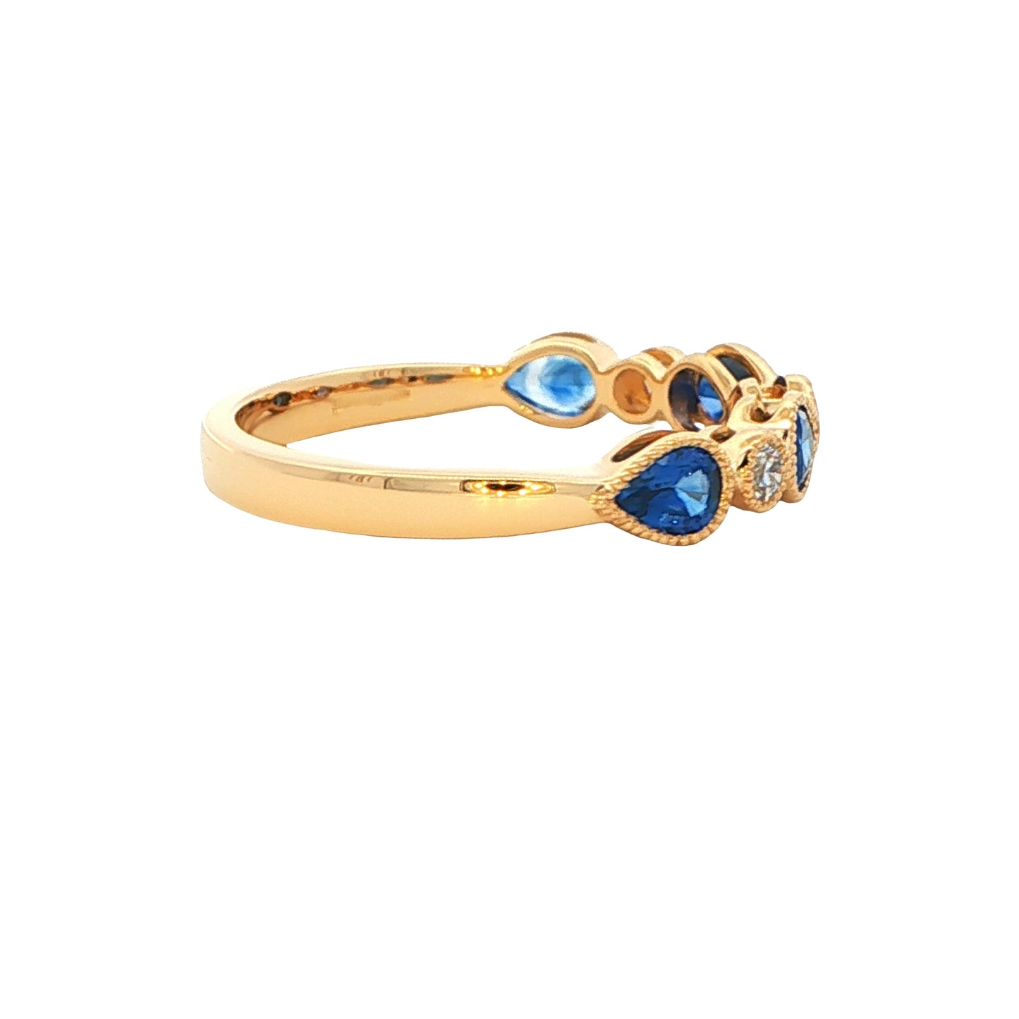 Pear shaped sapphire and round brilliant cut diamond ring