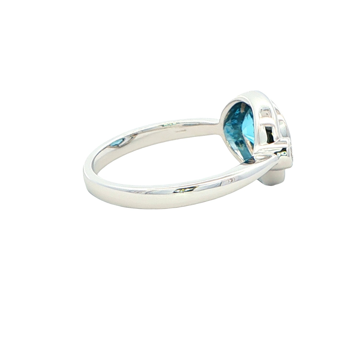 Oval shaped Topaz and round brilliant cut diamond ring