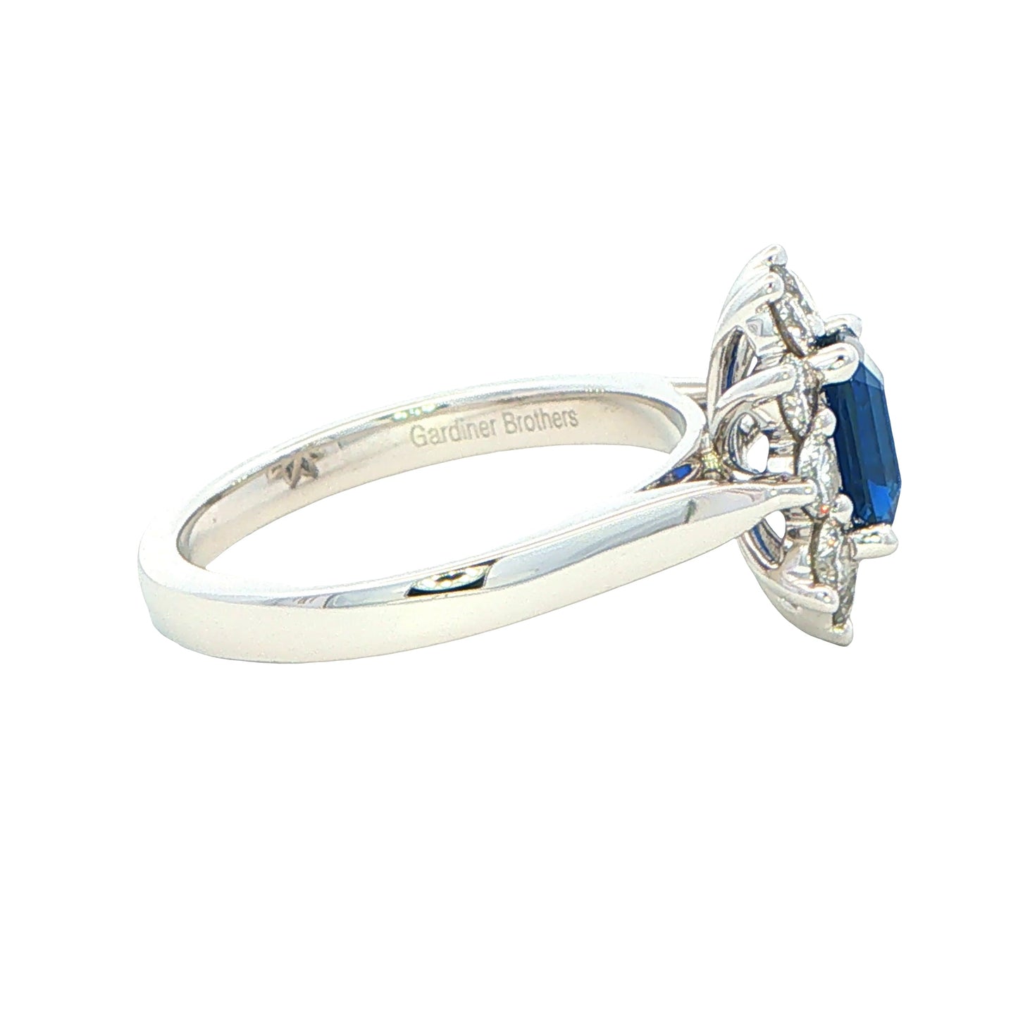 Octagonal Sapphire and round brilliant cut diamond cluster ring Gardiner Brothers