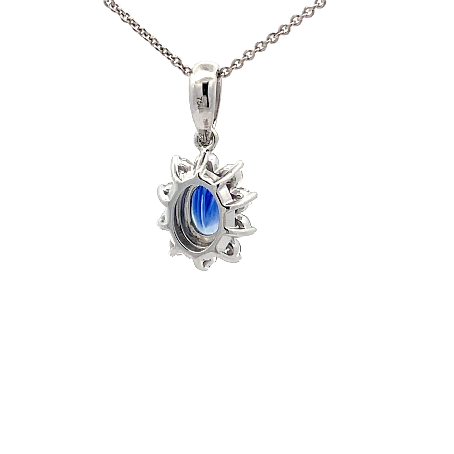 Sapphire and round brilliant cut diamond cluster style pendant Gardiner Brothers