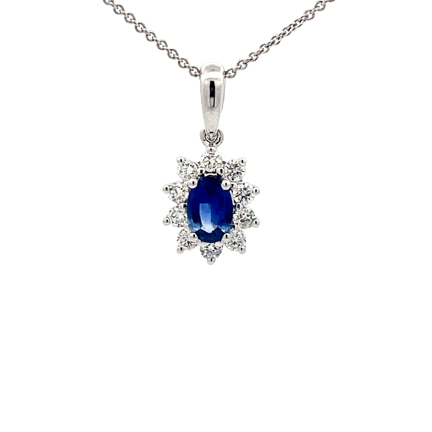Sapphire and round brilliant cut diamond cluster style pendant Gardiner Brothers