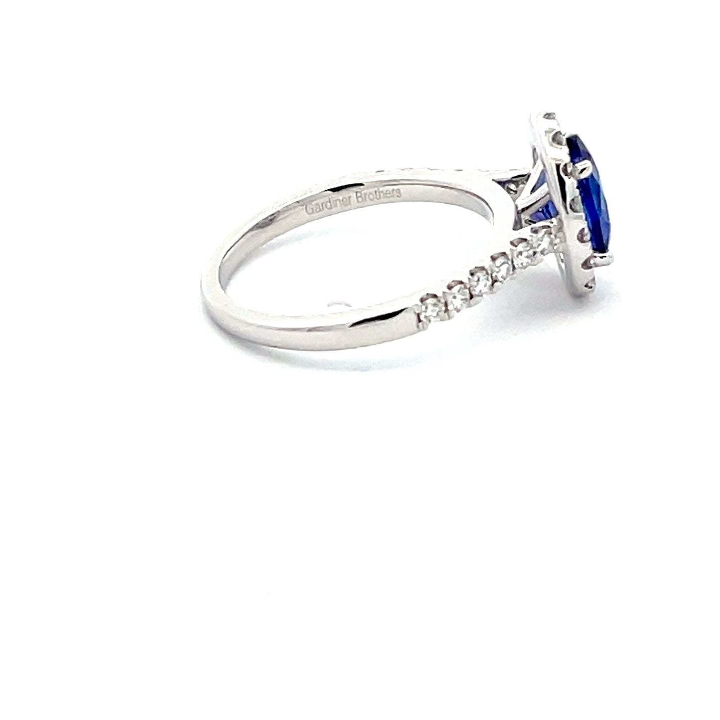 Tanzanite and Diamond Halo style Ring Gardiner Brothers