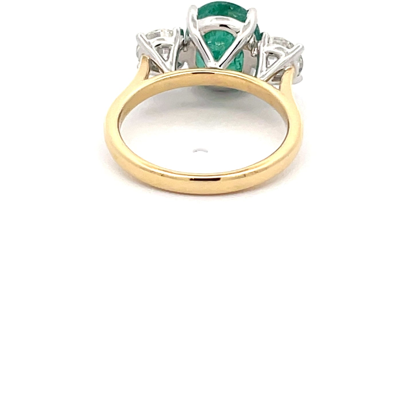 Emerald and round brilliant cut diamond 3 stone ring Gardiner Brothers